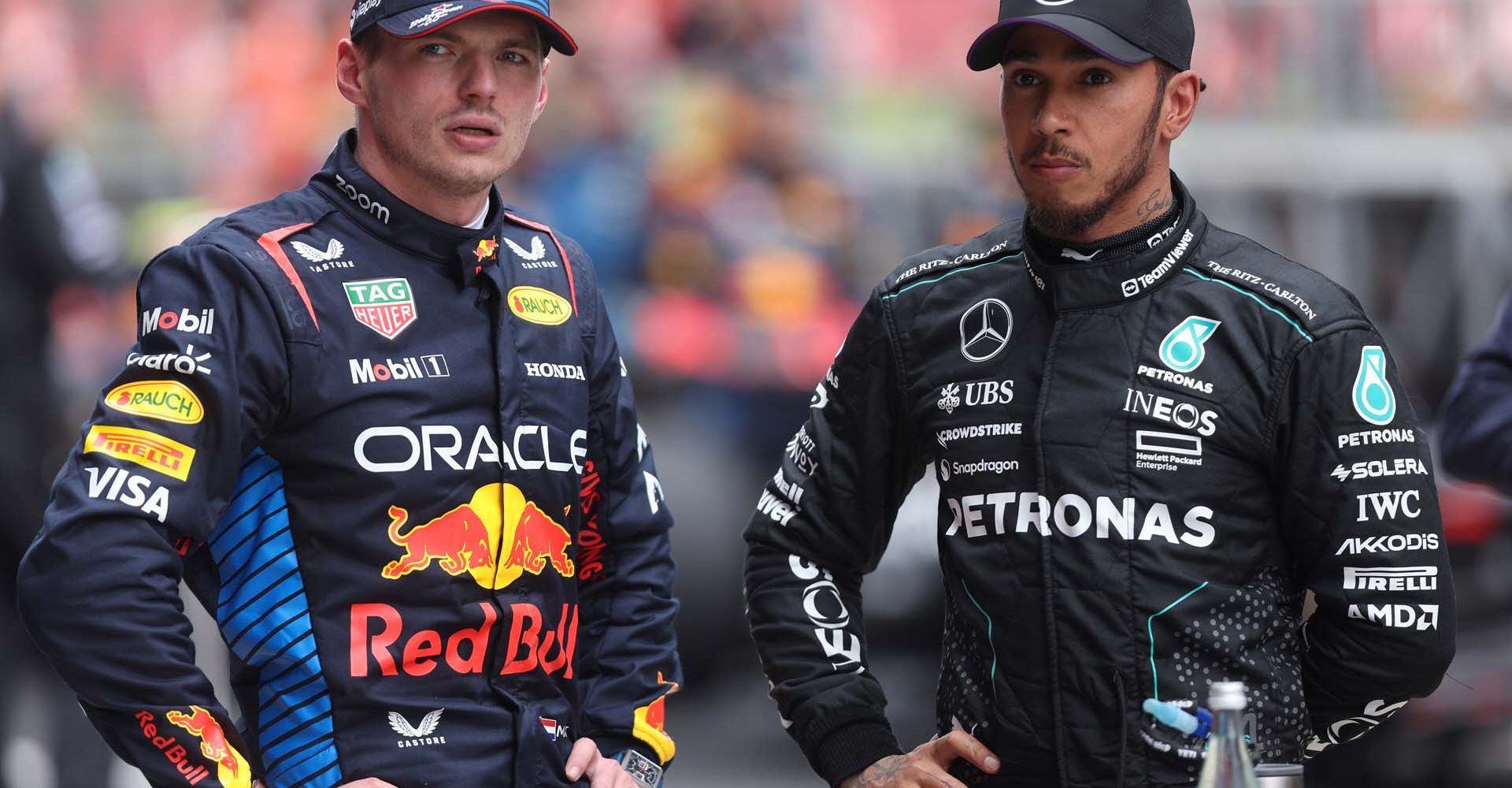 SHANGHAI, CHINA - APRIL 20: Sprint winner Max Verstappen of the Netherlands and Oracle Red Bull Racing and Second placed Lewis Hamilton of Great Britain and Mercedes look on in parc ferme during the Sprint ahead of the F1 Grand Prix of China at Shanghai International Circuit on April 20, 2024 in Shanghai, China. (Photo by Lars Baron/Getty Images) // Getty Images / Red Bull Content Pool // SI202404200123 // Usage for editorial use only //