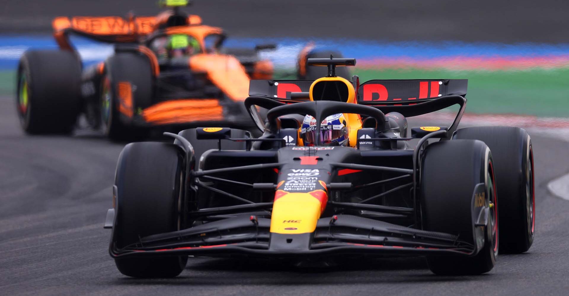 SHANGHAI, CHINA - APRIL 21: Max Verstappen of the Netherlands driving the (1) Oracle Red Bull Racing RB20 leads Lando Norris of Great Britain driving the (4) McLaren MCL38 Mercedes on track during the F1 Grand Prix of China at Shanghai International Circuit on April 21, 2024 in Shanghai, China. (Photo by Lars Baron/Getty Images) // Getty Images / Red Bull Content Pool // SI202404210228 // Usage for editorial use only //