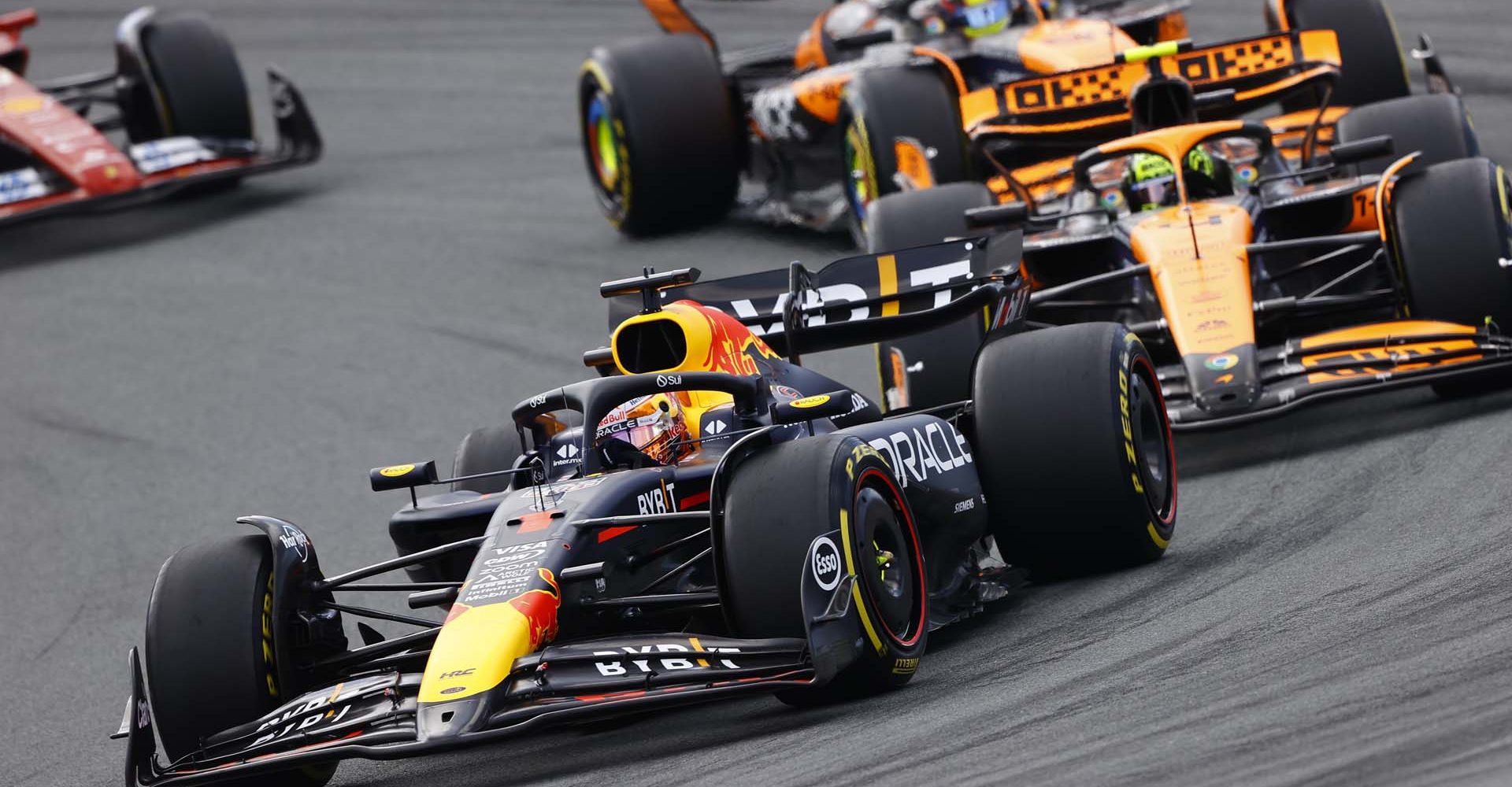 CIRCUIT ZANDVOORT, NETHERLANDS - AUGUST 25: Max Verstappen, Red Bull Racing RB20, leads Lando Norris, McLaren MCL38, and Oscar Piastri, McLaren MCL38 during the Dutch GP at Circuit Zandvoort on Sunday August 25, 2024 in North Holland, Netherlands. (Photo by Andy Hone / LAT Images)