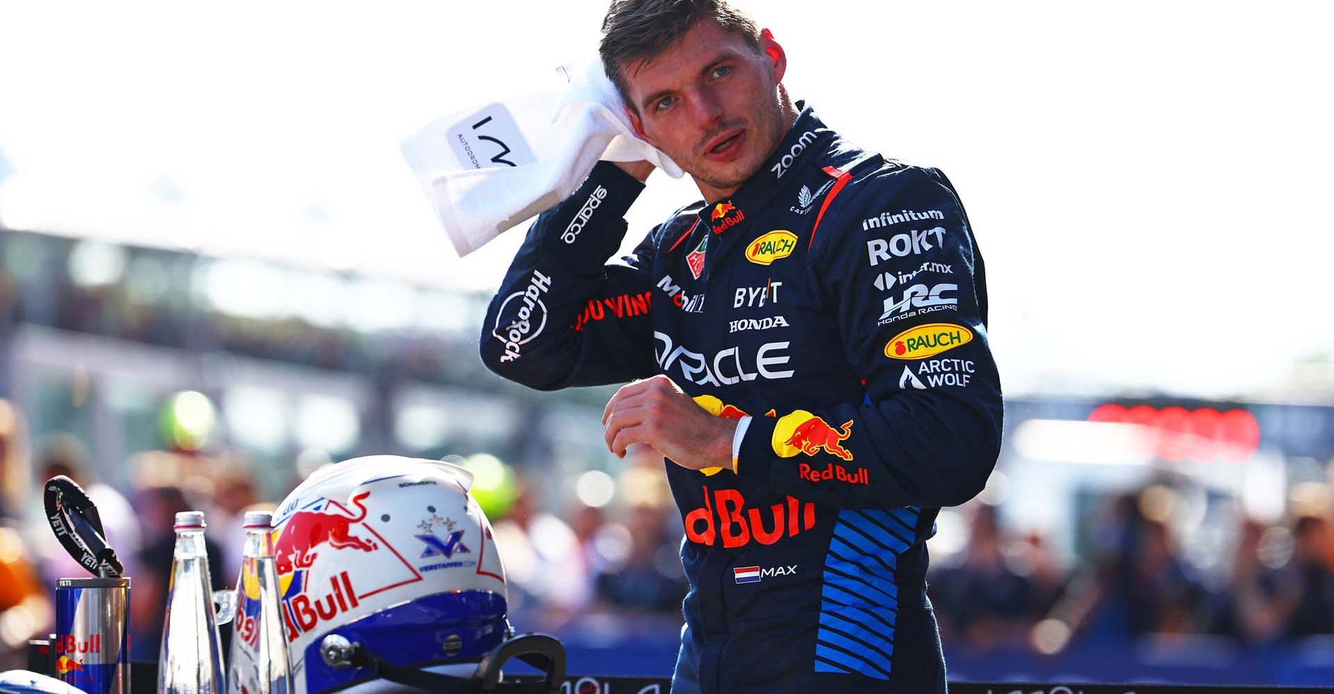 IMOLA, ITALY - MAY 18: Pole position qualifier Max Verstappen of the Netherlands and Oracle Red Bull Racing wipes his head with a towel in parc ferme during qualifying ahead of the F1 Grand Prix of Emilia-Romagna at Autodromo Enzo e Dino Ferrari Circuit on May 18, 2024 in Imola, Italy. (Photo by Mark Thompson/Getty Images) // Getty Images / Red Bull Content Pool // SI202405180414 // Usage for editorial use only //