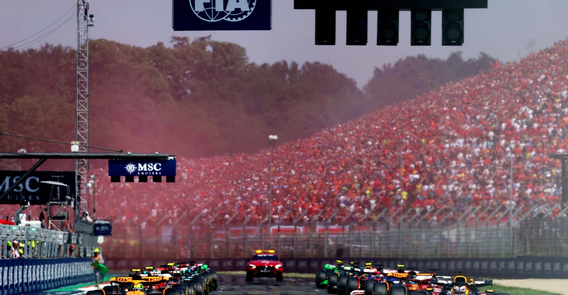 IMOLA, ITALY - MAY 19: Max Verstappen of the Netherlands driving the (1) Oracle Red Bull Racing RB20 and Lando Norris of Great Britain driving the (4) McLaren MCL38 Mercedes line up on the front row of the grid for the start during the F1 Grand Prix of Emilia-Romagna at Autodromo Enzo e Dino Ferrari Circuit on May 19, 2024 in Imola, Italy. (Photo by Clive Rose/Getty Images) // Getty Images / Red Bull Content Pool // SI202405190307 // Usage for editorial use only //