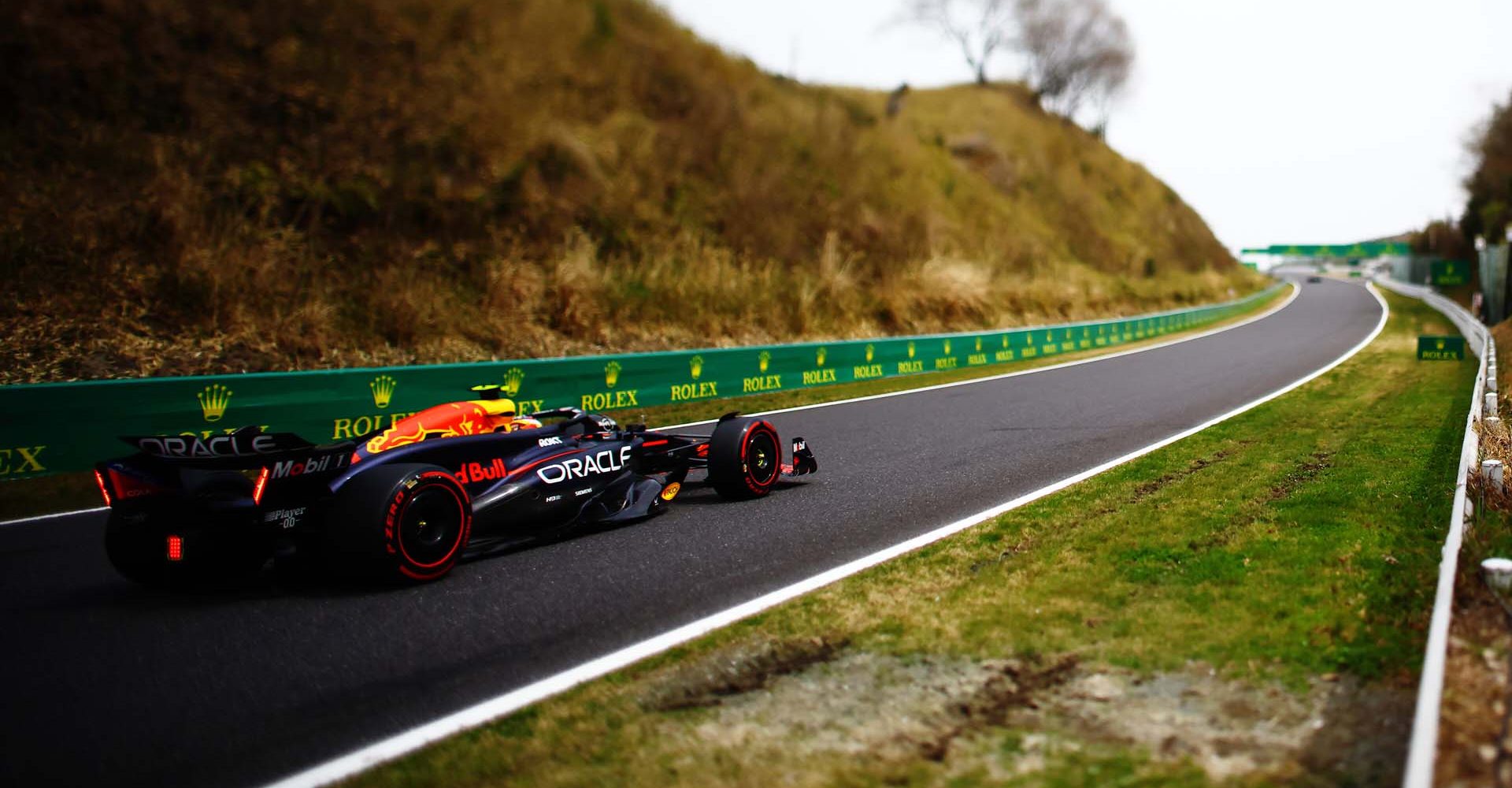 SUZUKA, JAPAN - APRIL 06: (EDITORS NOTE: This image was created with a variable plane focus lens) Sergio Perez of Mexico driving the (11) Oracle Red Bull Racing RB20 on track during final practice ahead of the F1 Grand Prix of Japan at Suzuka International Racing Course on April 06, 2024 in Suzuka, Japan. (Photo by Mark Thompson/Getty Images) // Getty Images / Red Bull Content Pool // SI202404060072 // Usage for editorial use only //