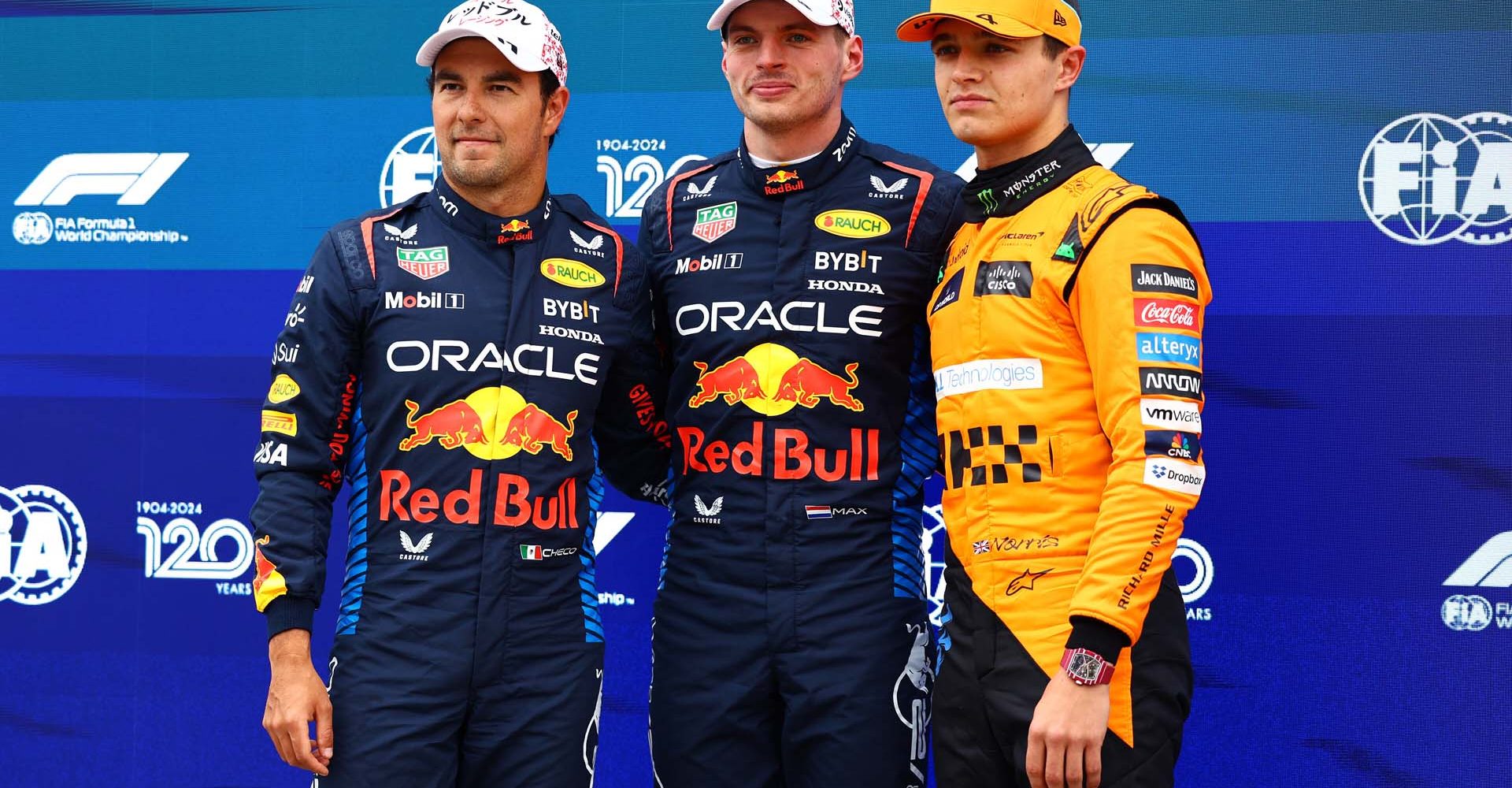 SUZUKA, JAPAN - APRIL 06: Pole position qualifier Max Verstappen of the Netherlands and Oracle Red Bull Racing (C), Second placed qualifier Sergio Perez of Mexico and Oracle Red Bull Racing (L) and Third placed qualifier Lando Norris of Great Britain and McLaren (R) pose for a photo in parc ferme during qualifying ahead of the F1 Grand Prix of Japan at Suzuka International Racing Course on April 06, 2024 in Suzuka, Japan. (Photo by Mark Thompson/Getty Images) // Getty Images / Red Bull Content Pool // SI202404060266 // Usage for editorial use only //