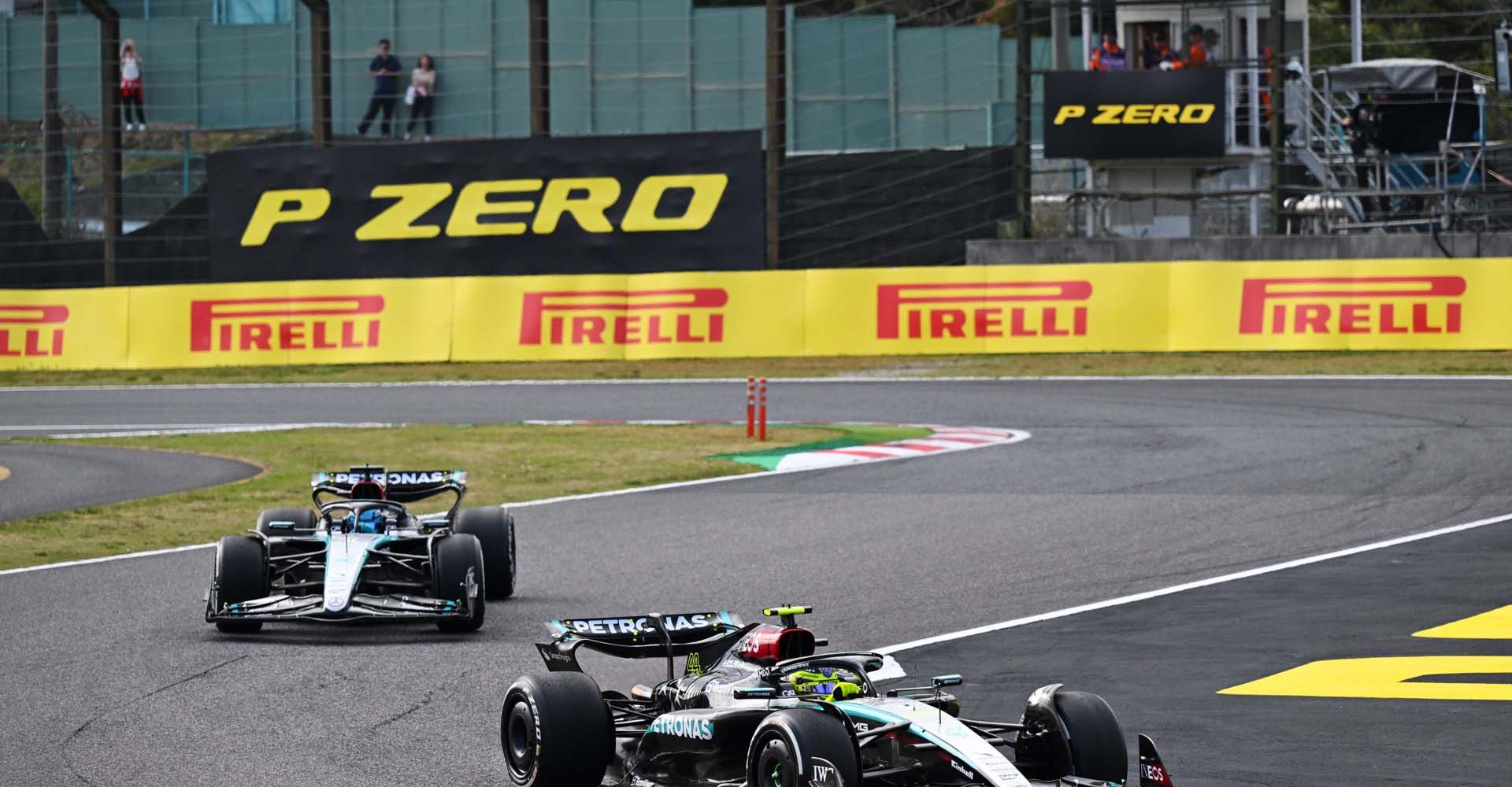 SUZUKA, JAPAN - APRIL 07: Sir Lewis Hamilton, Mercedes F1 W15, leads George Russell, Mercedes F1 W15 during the Japanese GP at Suzuka on Sunday April 07, 2024 in Suzuka, Japan. (Photo by Simon Galloway / LAT Images)