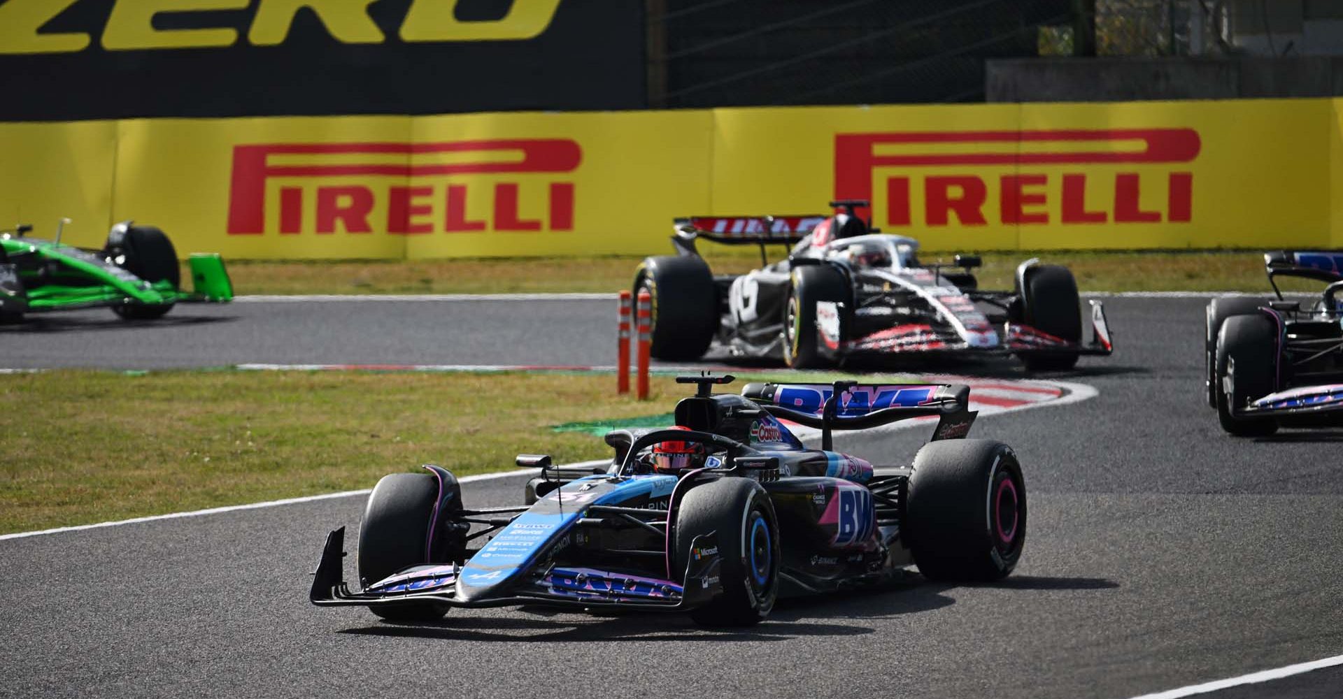 SUZUKA, JAPAN - APRIL 07: Esteban Ocon, Alpine A524, leads Pierre Gasly, Alpine A524, and Kevin Magnussen, Haas VF-24 during the Japanese GP at Suzuka on Sunday April 07, 2024 in Suzuka, Japan. (Photo by Simon Galloway / LAT Images)