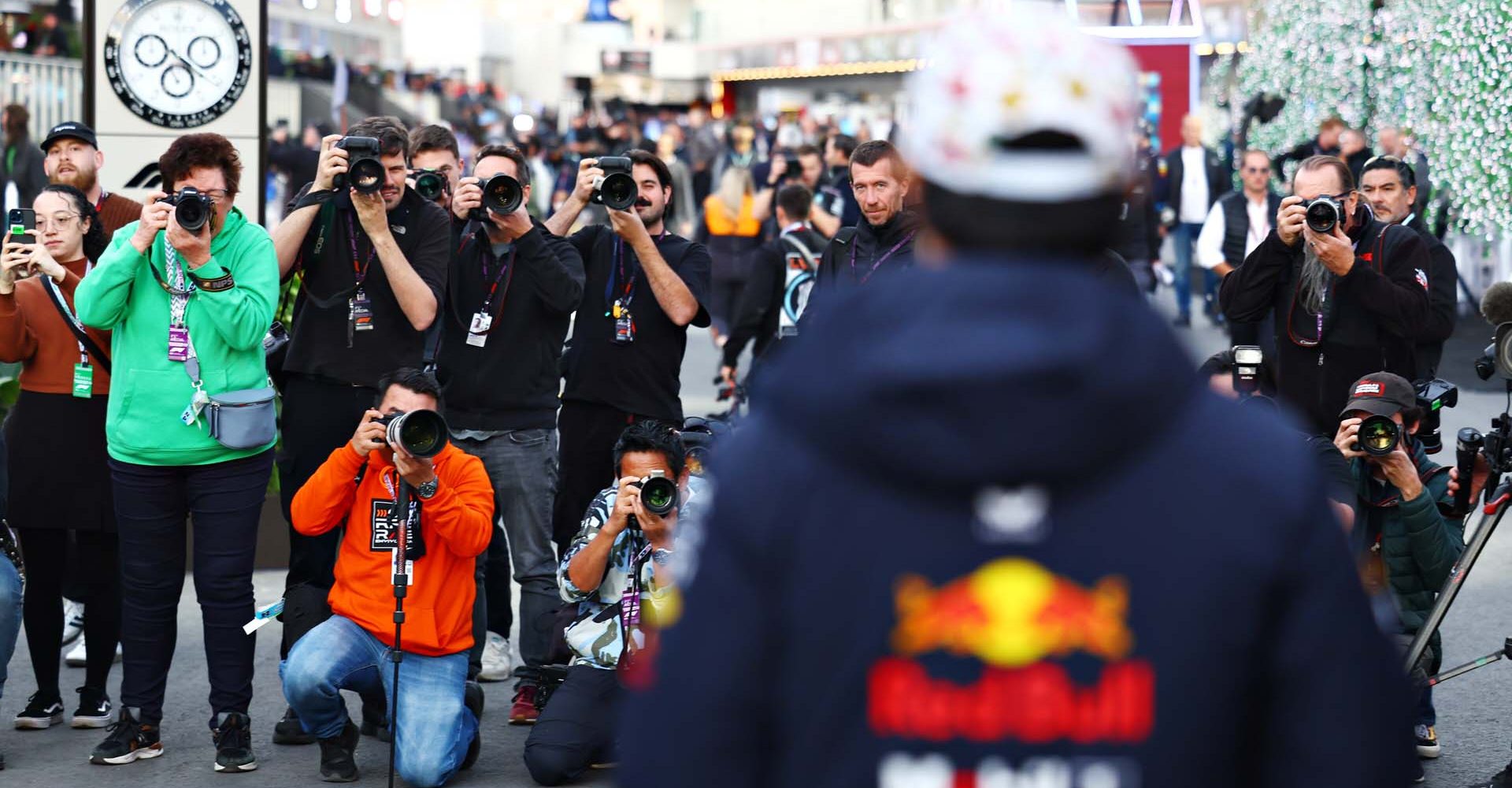 LAS VEGAS, NEVADA - NOVEMBER 22: Photographers line up to take a picture of Sergio Perez of Mexico and Oracle Red Bull Racing as he walks in the Paddock prior to final practice ahead of the F1 Grand Prix of Las Vegas at Las Vegas Strip Circuit on November 22, 2024 in Las Vegas, Nevada. (Photo by Mark Thompson/Getty Images) // Getty Images / Red Bull Content Pool // SI202411230025 // Usage for editorial use only //