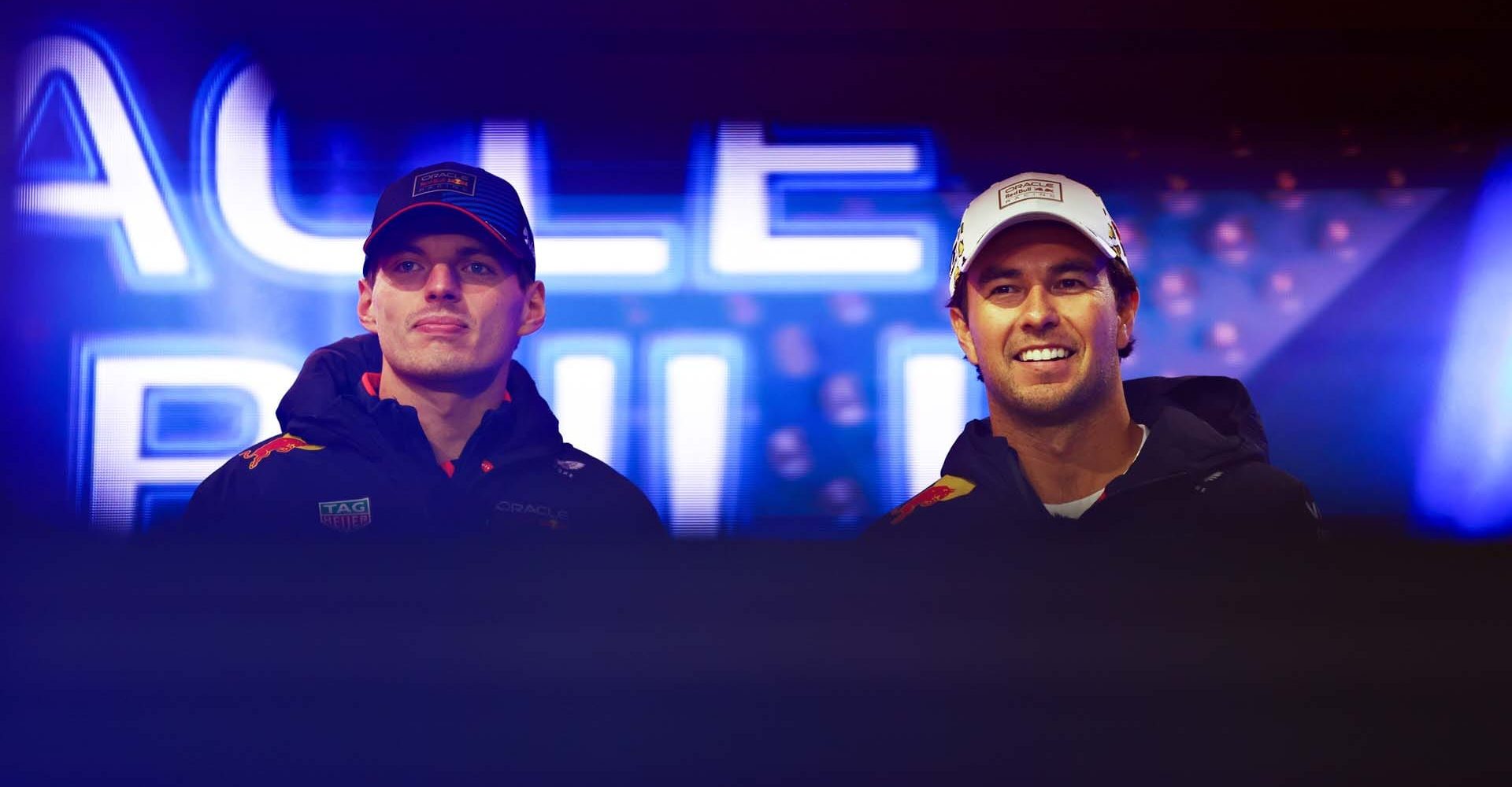 LAS VEGAS, NEVADA - NOVEMBER 22: Max Verstappen of the Netherlands and Oracle Red Bull Racing and Sergio Perez of Mexico and Oracle Red Bull Racing talk to the crowd on the fan stage prior to final practice ahead of the F1 Grand Prix of Las Vegas at Las Vegas Strip Circuit on November 22, 2024 in Las Vegas, Nevada. (Photo by Mark Thompson/Getty Images) // Getty Images / Red Bull Content Pool // SI202411230029 // Usage for editorial use only //