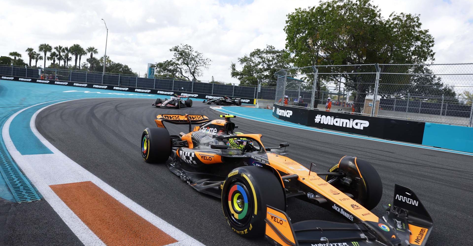 Lando Norris, McLaren MCL38, leads Nico Hulkenberg, Haas VF-24