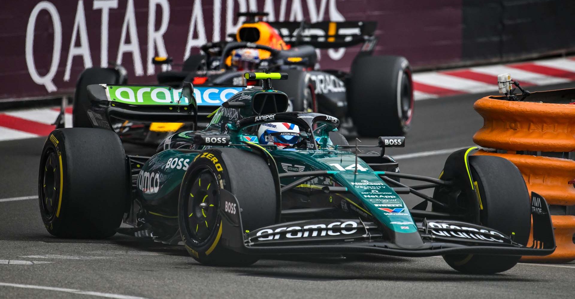 Fernando Alonso (Aston Martin) followed by Max Verstappen (Red Bull)