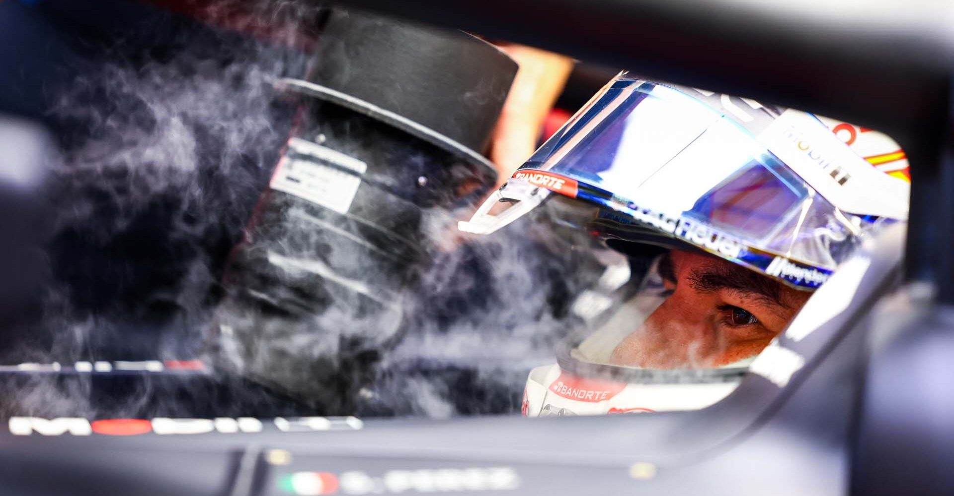 SINGAPORE, SINGAPORE - SEPTEMBER 20: Sergio Perez of Mexico driving the (11) Oracle Red Bull Racing RB20 prepares to drive in the garage during practice ahead of the F1 Grand Prix of Singapore at Marina Bay Street Circuit on September 20, 2024 in Singapore, Singapore. (Photo by Mark Thompson/Getty Images) // Getty Images / Red Bull Content Pool // SI202409200259 // Usage for editorial use only //