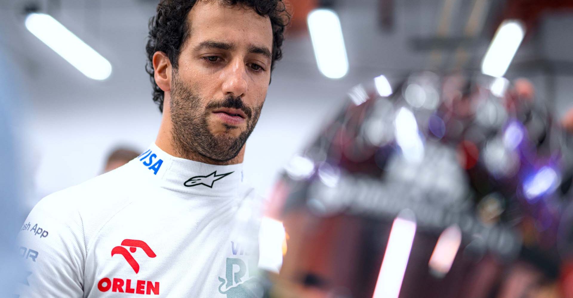 SINGAPORE, SINGAPORE - SEPTEMBER 21: Daniel Ricciardo of Australia and Visa Cash App RB prepares to drive in the garage during qualifying ahead of the F1 Grand Prix of Singapore at Marina Bay Street Circuit on September 21, 2024 in Singapore, Singapore. (Photo by Rudy Carezzevoli/Getty Images) // Getty Images / Red Bull Content Pool // SI202409210480 // Usage for editorial use only //