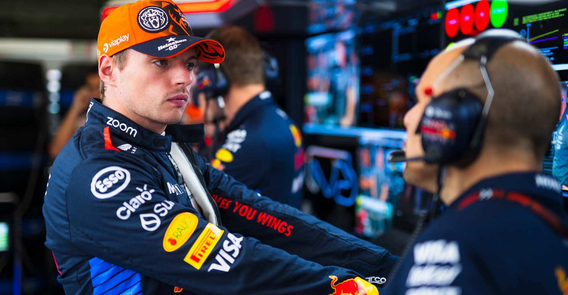 BARCELONA, SPAIN - JUNE 21: Max Verstappen of the Netherlands and Oracle Red Bull Racing talks with race engineer Gianpiero Lambiase in the garage during practice ahead of the F1 Grand Prix of Spain at Circuit de Barcelona-Catalunya on June 21, 2024 in Barcelona, Spain. (Photo by Rudy Carezzevoli/Getty Images) // Getty Images / Red Bull Content Pool // SI202406210653 // Usage for editorial use only //