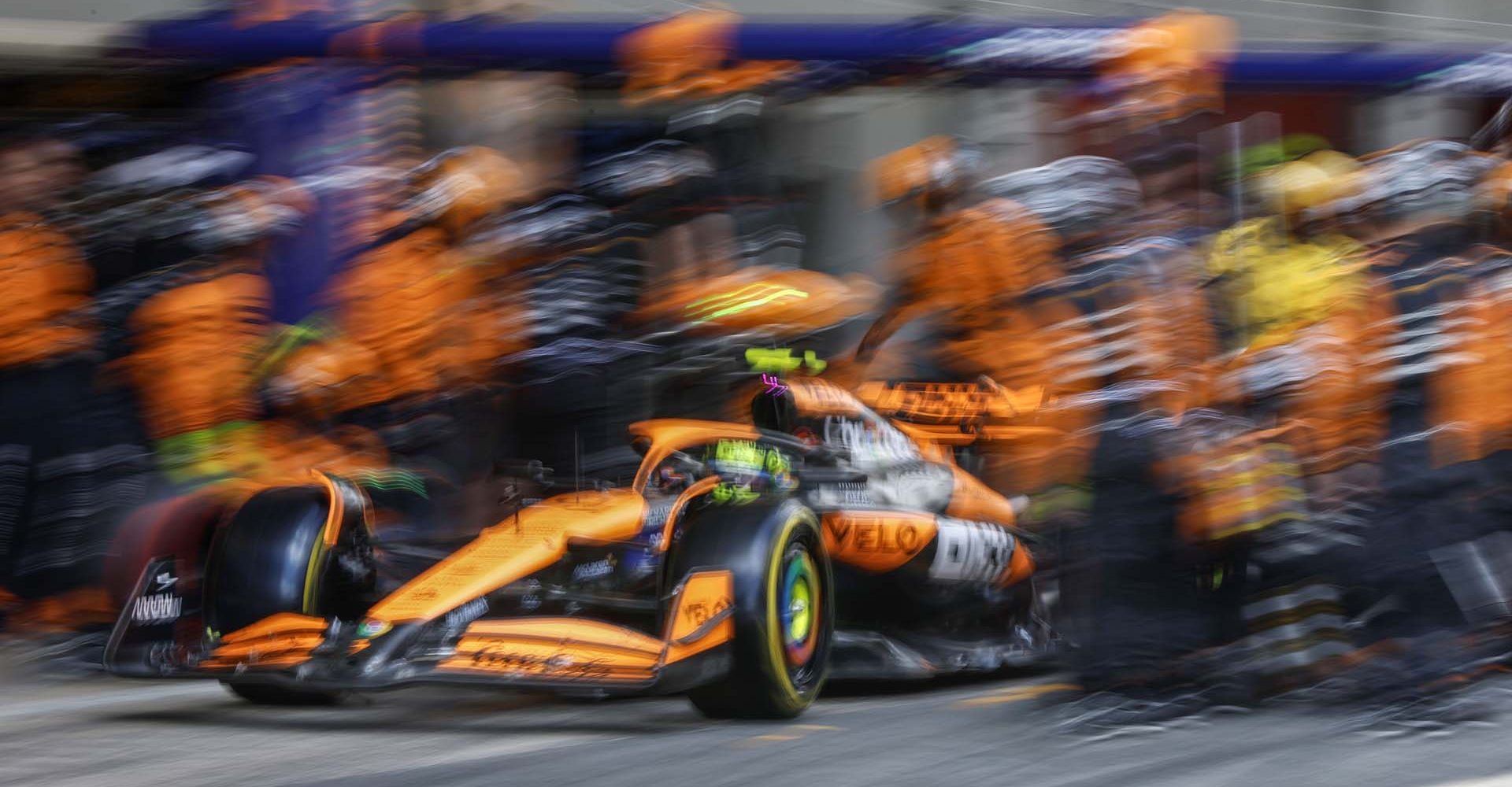 Lando Norris, McLaren MCL38, leaves his pit box after a stop