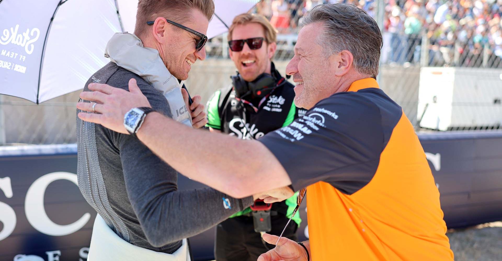 AUSTIN, TEXAS - OCTOBER 19: Nico Hulkenberg of Germany and Stake F1 Team Kick Sauber and Zak Brown, Chief Executive Officer of McLaren greet each other on the grid prior to the F1 Grand Prix of United States at Circuit of The Americas on October 19, 2025 in Austin, Texas. (Photo by Andy Hone/LAT Images)