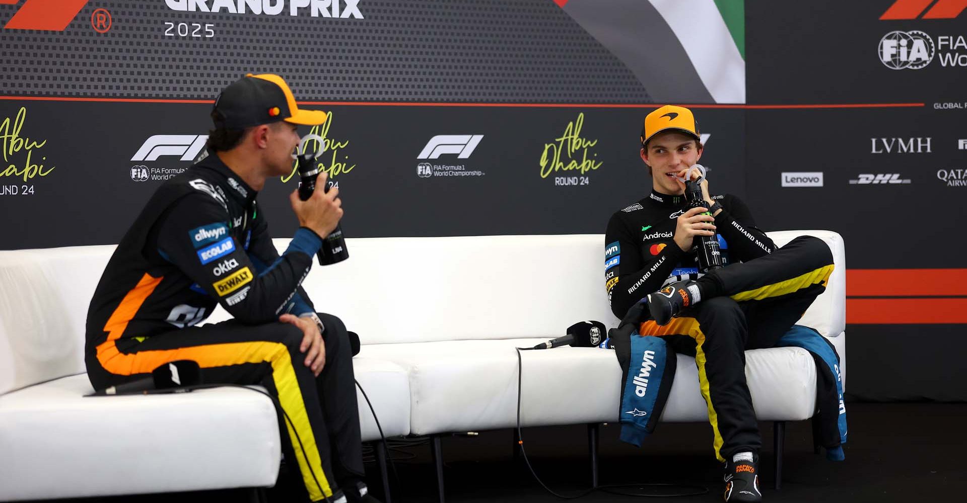 ABU DHABI, UNITED ARAB EMIRATES - DECEMBER 06: Second placed qualifier Lando Norris of Great Britain and McLaren and Third placed qualifier Oscar Piastri of Australia and McLaren talk in the Drivers Press Conference during qualifying ahead of the F1 Grand Prix of Abu Dhabi at Yas Marina Circuit on December 06, 2025 in Abu Dhabi, United Arab Emirates. (Photo by Bryn Lennon/Getty Images)