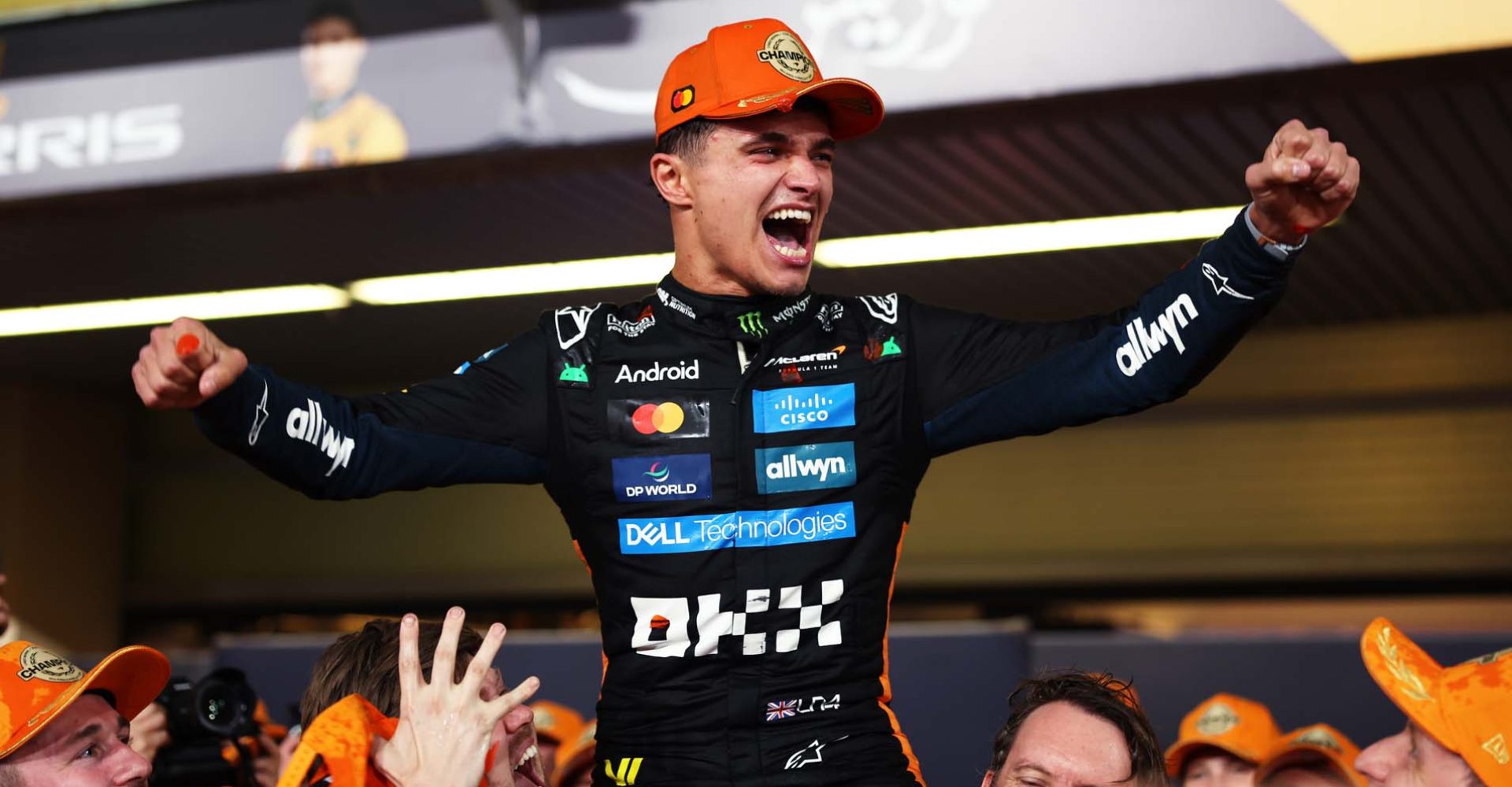 ABU DHABI, UNITED ARAB EMIRATES - DECEMBER 07: 2025 F1 World Drivers Champion Lando Norris of Great Britain and McLaren celebrates with his team during the F1 Grand Prix of Abu Dhabi at Yas Marina Circuit on December 07, 2025 in Abu Dhabi, United Arab Emirates. (Photo by Andy Hone/LAT Images)
