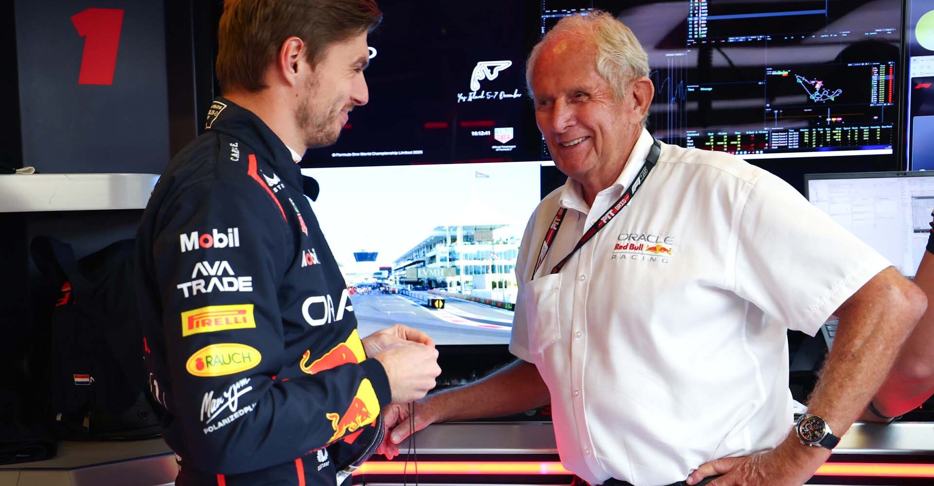 ABU DHABI, UNITED ARAB EMIRATES - DECEMBER 07: Max Verstappen of the Netherlands and Oracle Red Bull Racing and Dr Helmut Marko, Team Consultant of Oracle Red Bull Racing talk in the garage prior to the F1 Grand Prix of Abu Dhabi at Yas Marina Circuit on December 07, 2025 in Abu Dhabi, United Arab Emirates. (Photo by Mark Thompson/Getty Images) // Getty Images / Red Bull Content Pool // SI202512070113 // Usage for editorial use only //
