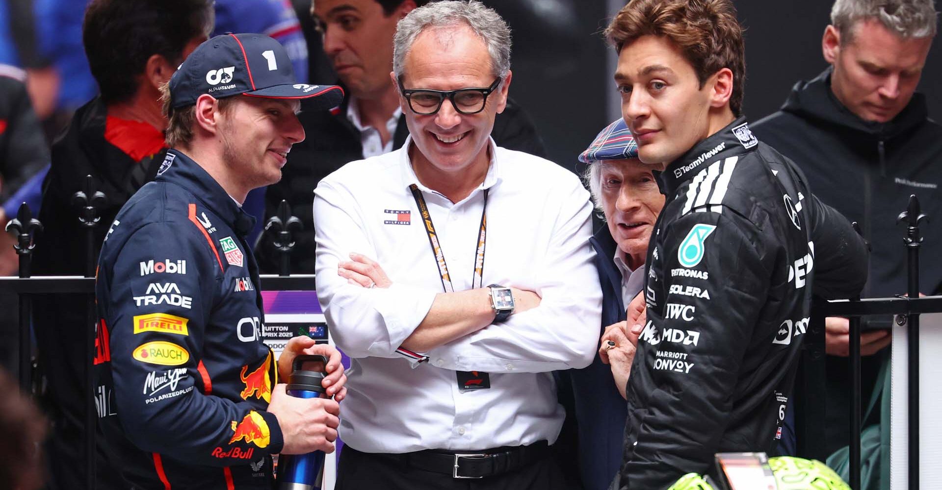 MELBOURNE, AUSTRALIA - MARCH 16: Second placed Max Verstappen of the Netherlands and Oracle Red Bull Racing and Third placed George Russell of Great Britain and Mercedes AMG Petronas F1 Team with Stefano Domenicali, CEO of the Formula One Group in parc ferme during the F1 Grand Prix of Australia at Albert Park Grand Prix Circuit on March 16, 2025 in Melbourne, Australia. (Photo by Clive Rose/Getty Images) // Getty Images / Red Bull Content Pool // SI202503160112 // Usage for editorial use only //