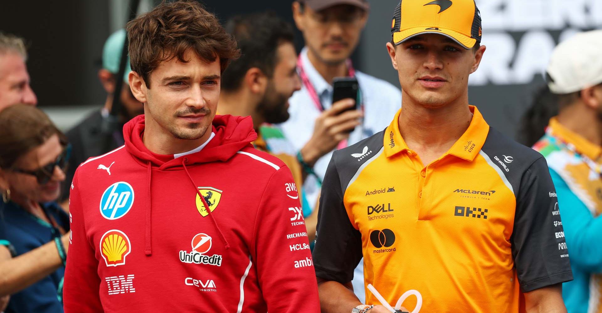 BAKU, AZERBAIJAN - SEPTEMBER 21: Charles Leclerc of Monaco and Scuderia Ferrari and Lando Norris of Great Britain and McLaren on the drivers parade prior to the F1 Grand Prix of Azerbaijan at Baku City Circuit on September 21, 2025 in Baku, Azerbaijan. (Photo by Sam Bloxham/LAT Images)