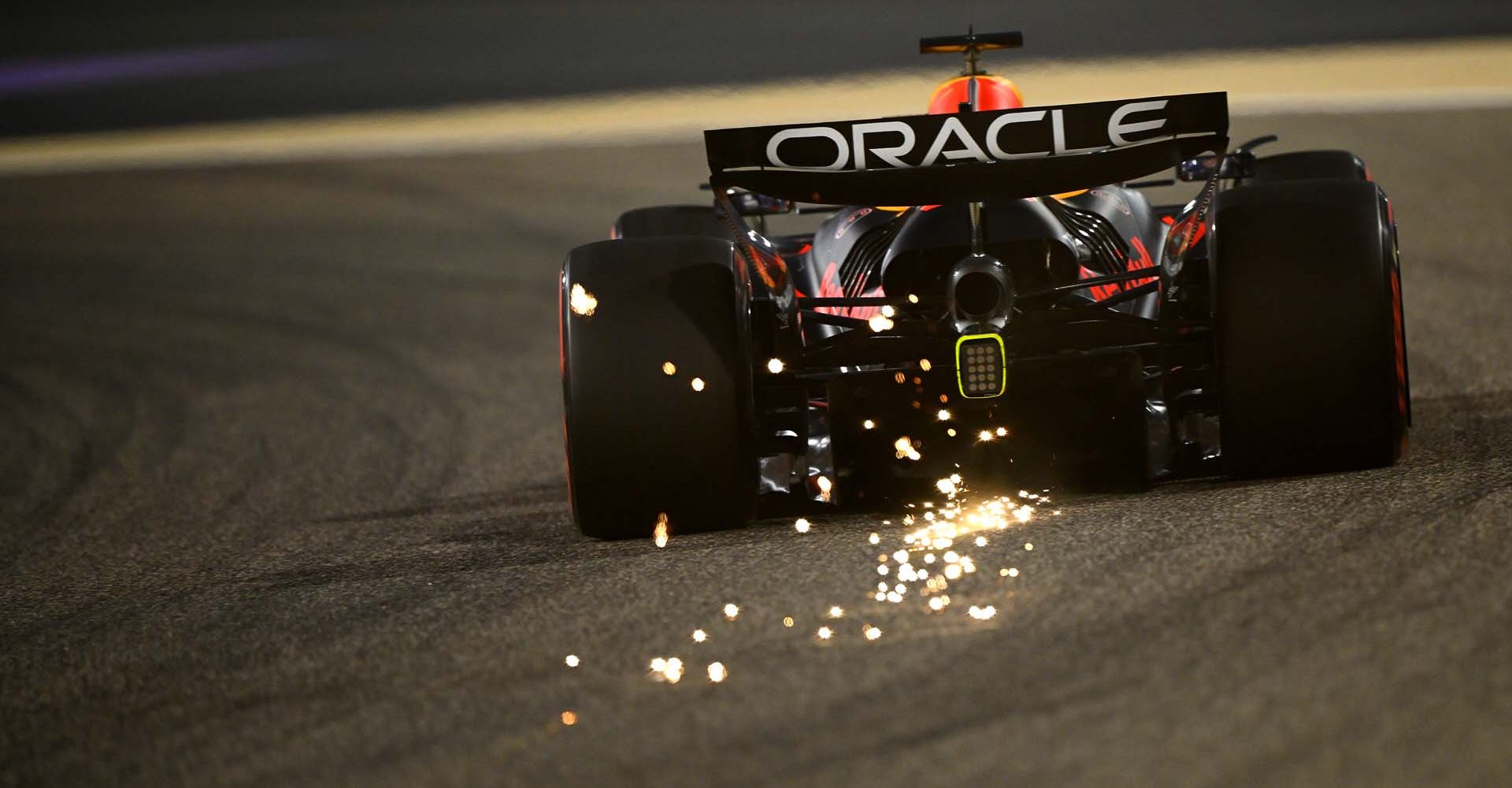 BAHRAIN, BAHRAIN - APRIL 11: Sparks fly behind Max Verstappen of the Netherlands driving the (1) Oracle Red Bull Racing RB21 on track during practice ahead of the F1 Grand Prix of Bahrain at Bahrain International Circuit on April 11, 2025 in Bahrain, Bahrain. (Photo by Clive Mason/Getty Images) // Getty Images / Red Bull Content Pool // SI202504110698 // Usage for editorial use only //