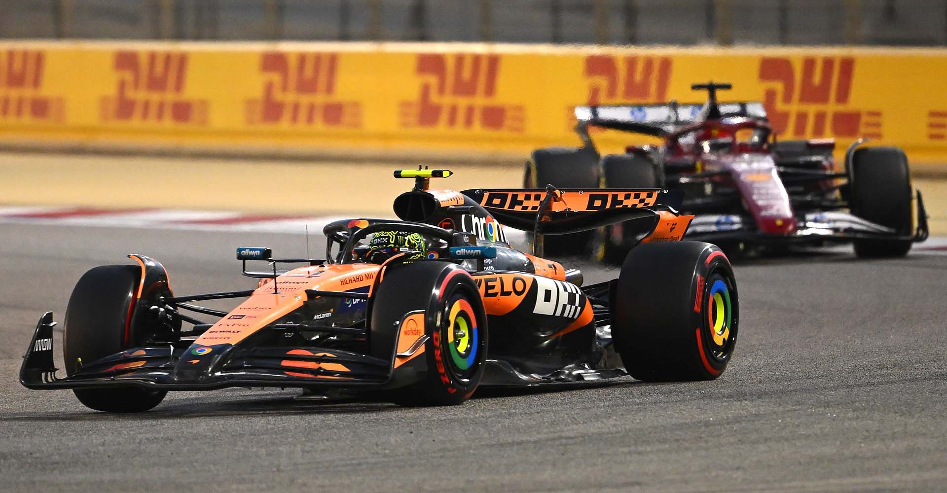 BAHRAIN, BAHRAIN - APRIL 13: Lando Norris of Great Britain driving the (4) McLaren MCL39 Mercedes leads Charles Leclerc of Monaco driving the (16) Scuderia Ferrari SF-25 on track during the F1 Grand Prix of Bahrain at Bahrain International Circuit on April 13, 2025 in Bahrain, Bahrain. (Photo by Clive Mason/Getty Images)