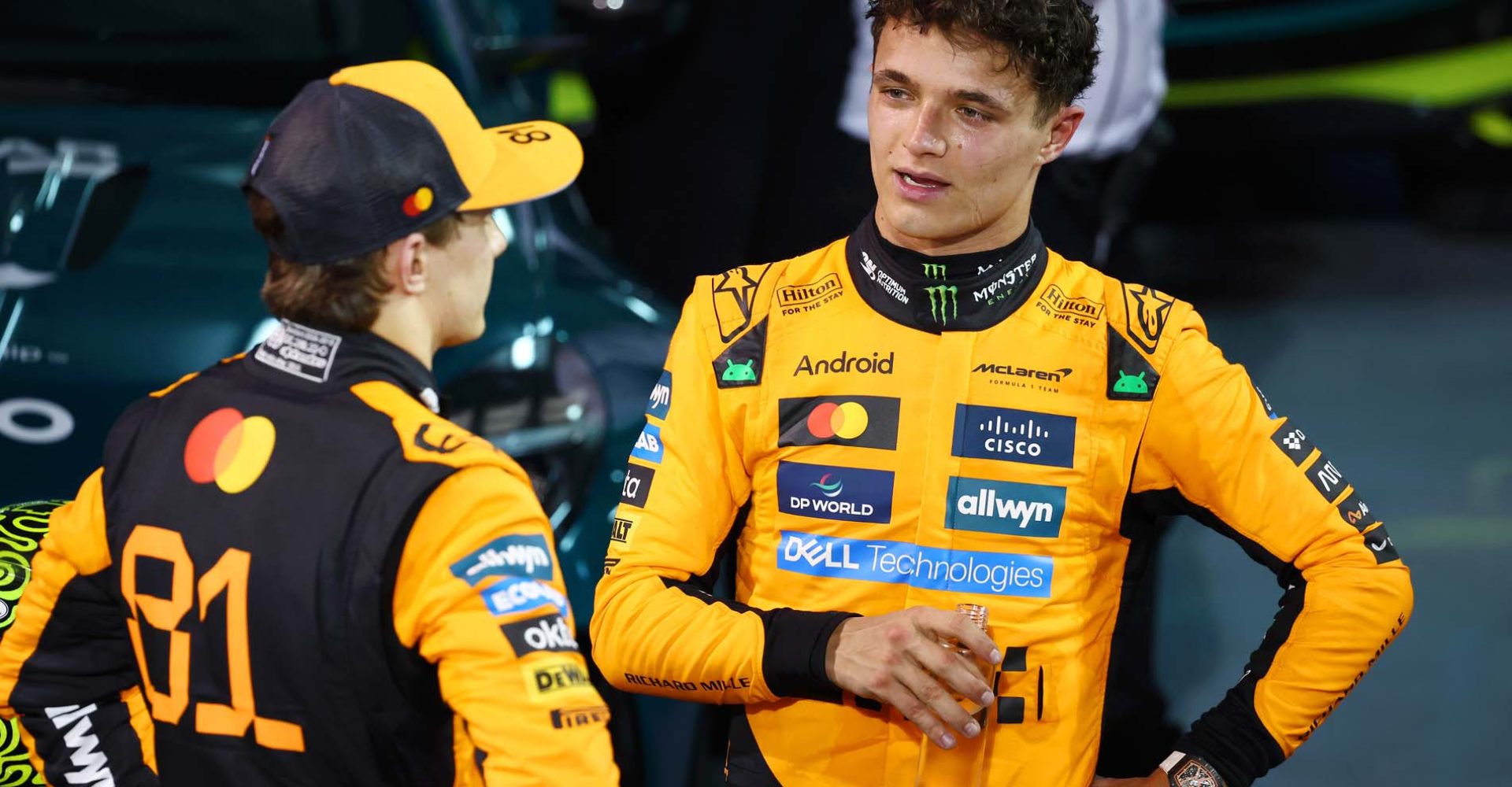 BAHRAIN, BAHRAIN - APRIL 13: Race winner Oscar Piastri of Australia and McLaren and Third placed Lando Norris of Great Britain and McLaren talk in parc ferme during the F1 Grand Prix of Bahrain at Bahrain International Circuit on April 13, 2025 in Bahrain, Bahrain. (Photo by Clive Rose/Getty Images)