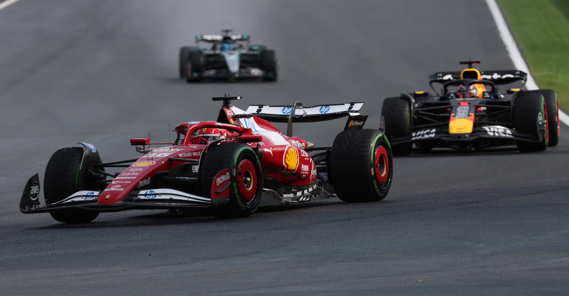 SPA, BELGIUM - JULY 27: Charles Leclerc of Monaco driving the (16) Scuderia Ferrari SF-25 leads Max Verstappen of the Netherlands driving the (1) Oracle Red Bull Racing RB21 and George Russell of Great Britain driving the (63) Mercedes AMG Petronas F1 Team W16 on track during the F1 Grand Prix of Belgium at Circuit de Spa-Francorchamps on July 27, 2025 in Spa, Belgium. (Photo by Mark Thompson/Getty Images) // Getty Images / Red Bull Content Pool // SI202507271413 // Usage for editorial use only //