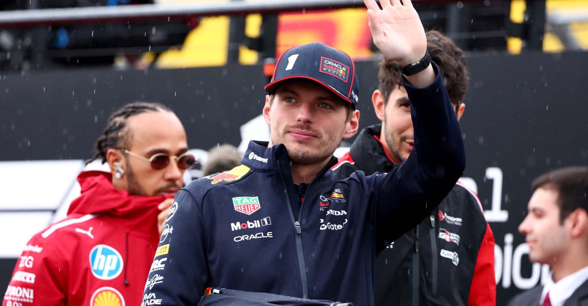 NORTHAMPTON, ENGLAND - JULY 06: Max Verstappen of the Netherlands and Oracle Red Bull Racing waves on the drivers parade prior to the F1 Grand Prix of Great Britain at Silverstone Circuit on July 06, 2025 in Northampton, England. (Photo by Clive Rose/Getty Images) // Getty Images / Red Bull Content Pool // SI202507060120 // Usage for editorial use only //