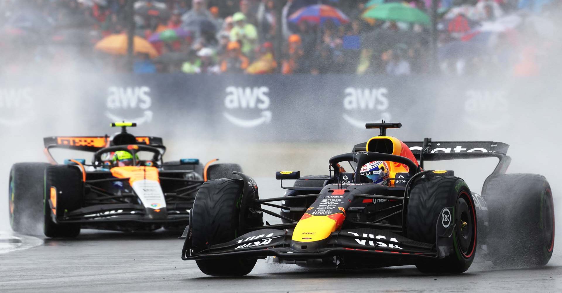 NORTHAMPTON, ENGLAND - JULY 06: Max Verstappen of the Netherlands driving the (1) Oracle Red Bull Racing RB21 leads Lando Norris of Great Britain driving the (4) McLaren MCL39 Mercedes on track during the F1 Grand Prix of Great Britain at Silverstone Circuit on July 06, 2025 in Northampton, England. (Photo by Glenn Dunbar/LAT Images) // Getty Images / Red Bull Content Pool // SI202507060303 // Usage for editorial use only //