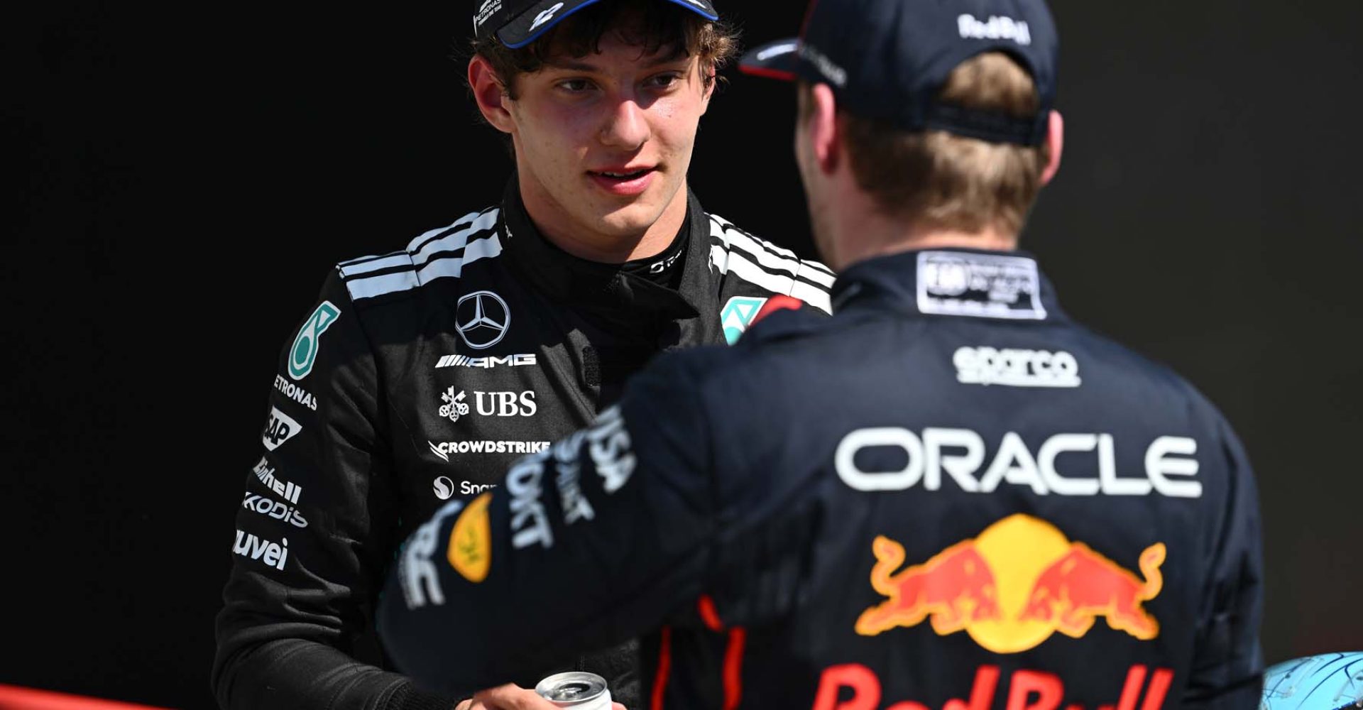 MONTREAL, QUEBEC - JUNE 15: Third placed Andrea Kimi Antonelli of Italy and Mercedes AMG Petronas F1 Team and Second placed Max Verstappen of the Netherlands and Oracle Red Bull Racing talk in parc ferme during the F1 Grand Prix of Canada at Circuit Gilles-Villeneuve on June 15, 2025 in Montreal, Quebec. (Photo by Minas Panagiotakis/Getty Images) // Getty Images / Red Bull Content Pool // SI202506150815 // Usage for editorial use only //