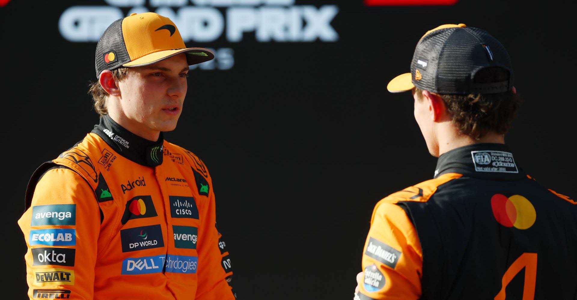 SHANGHAI, CHINA - MARCH 22: Pole position qualifier Oscar Piastri of Australia and McLaren and Third placed qualifier Lando Norris of Great Britain and McLaren talk in parc ferme during qualifying ahead of the F1 Grand Prix of China at Shanghai International Circuit on March 22, 2025 in Shanghai, China. (Photo by Sam Bloxham/LAT Images)