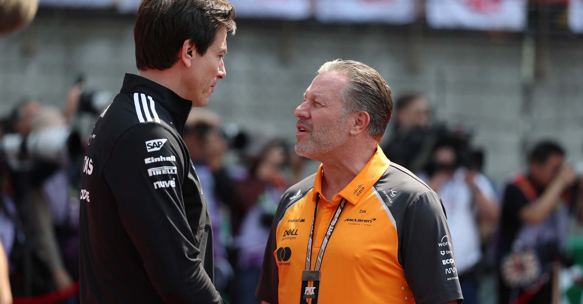 SHANGHAI, CHINA - MARCH 23: Toto Wolff, Executive Director of Mercedes AMG Petronas F1 Team and Zak Brown, Chief Executive Officer of McLaren talk in the Paddock prior to the F1 Grand Prix of China at Shanghai International Circuit on March 23, 2025 in Shanghai, China. (Photo by Mark Thompson/Getty Images)
