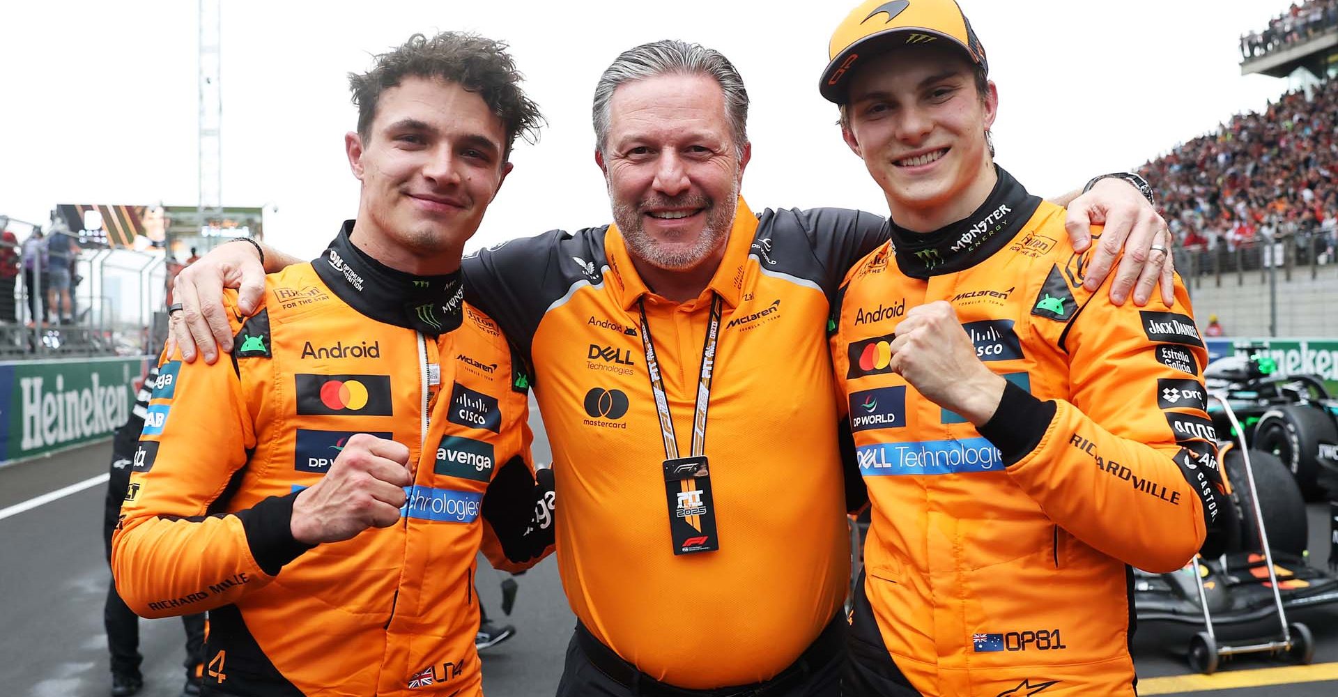 SHANGHAI, CHINA - MARCH 23: Second placed Lando Norris of Great Britain and McLaren Zak Brown, Chief Executive Officer of McLaren and Race winner Oscar Piastri of Australia and McLaren celebrate in parc ferme during the F1 Grand Prix of China at Shanghai International Circuit on March 23, 2025 in Shanghai, China. (Photo by Steven Tee/LAT Images)