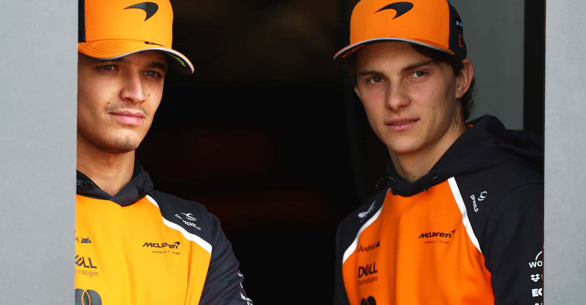 SHANGHAI, CHINA - MARCH 20: Lando Norris of Great Britain and McLaren and Oscar Piastri of Australia and McLaren looks on from the garage during previews ahead of the F1 Grand Prix of China at Shanghai International Circuit on March 20, 2025 in Shanghai, China. (Photo by Clive Rose/Getty Images)