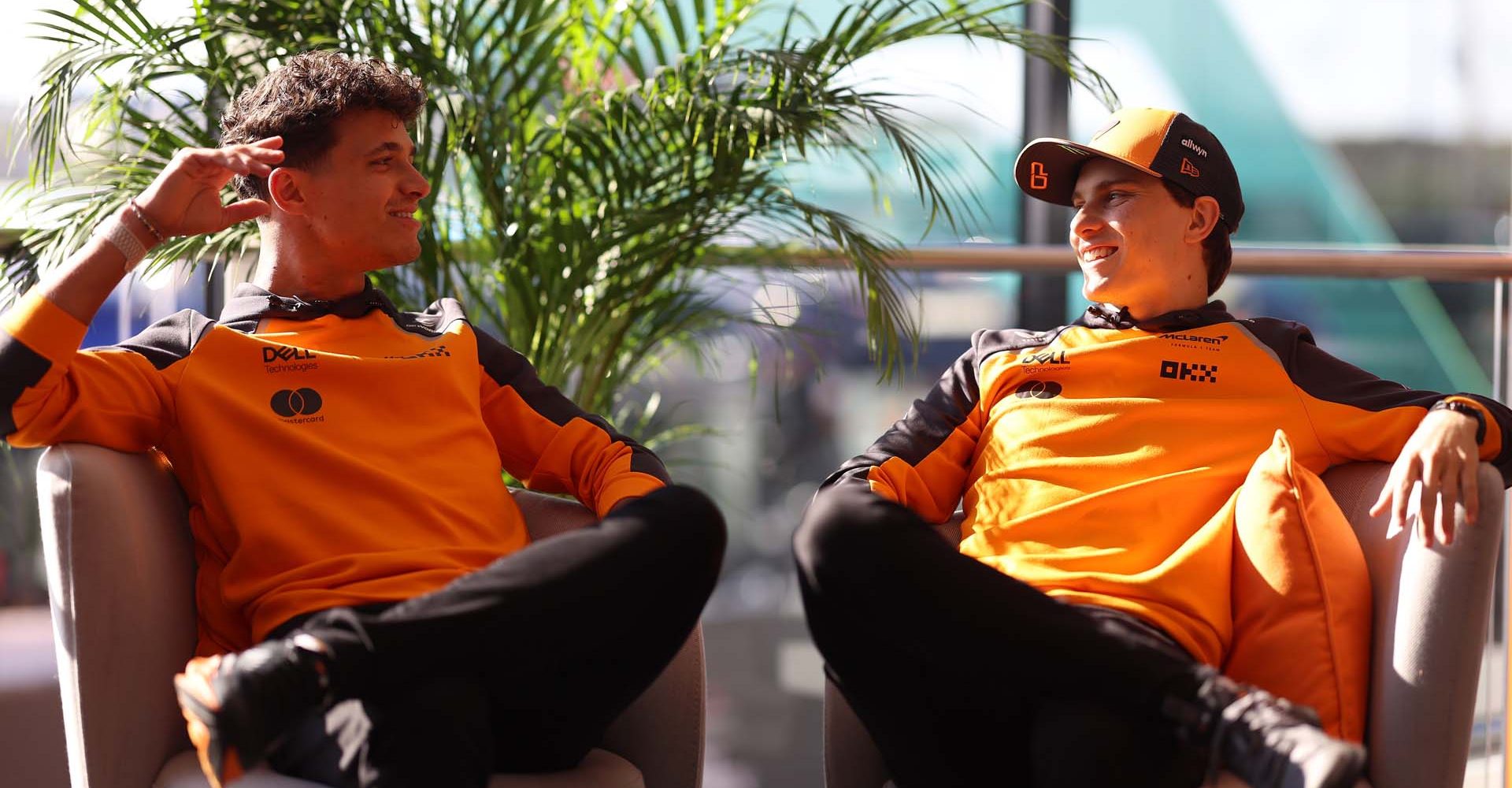 ZANDVOORT, NETHERLANDS - AUGUST 28: Lando Norris of Great Britain and McLaren and Oscar Piastri of Australia and McLaren are interviewed during previews ahead of the F1 Grand Prix of Netherlands at Circuit Zandvoort on August 28, 2025 in Zandvoort, Netherlands. (Photo by Alastair Staley/LAT Images)
