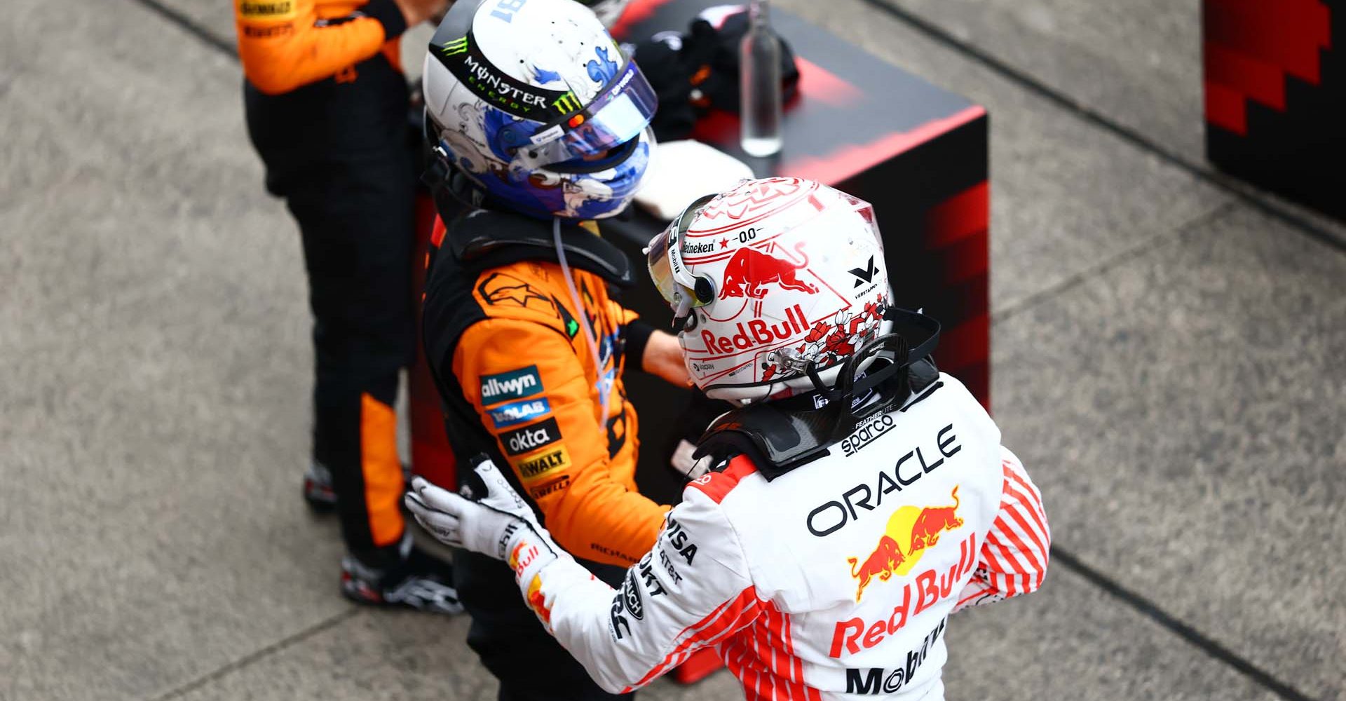 SUZUKA, JAPAN - APRIL 06: Third placed Oscar Piastri of Australia and McLaren and Race winner Max Verstappen of the Netherlands and Oracle Red Bull Racing in parc ferme during the F1 Grand Prix of Japan at Suzuka Circuit on April 06, 2025 in Suzuka, Japan. (Photo by Zak Mauger/LAT Images)