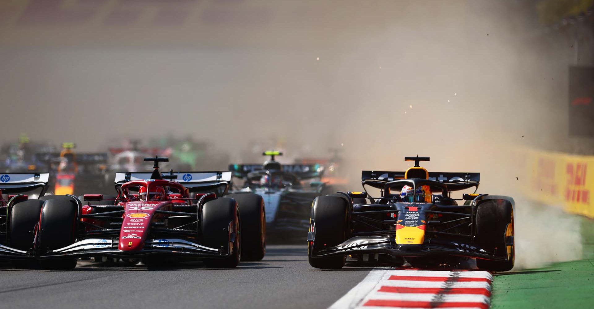 MEXICO CITY, MEXICO - OCTOBER 26: Charles Leclerc of Monaco driving the (16) Scuderia Ferrari SF-25 and Max Verstappen of the Netherlands driving the (1) Oracle Red Bull Racing RB21 battle for track position at the start during the F1 Grand Prix of Mexico at Autodromo Hermanos Rodriguez on October 26, 2025 in Mexico City, Mexico. (Photo by Clive Rose/Getty Images) // Getty Images / Red Bull Content Pool // SI202510260472 // Usage for editorial use only //
