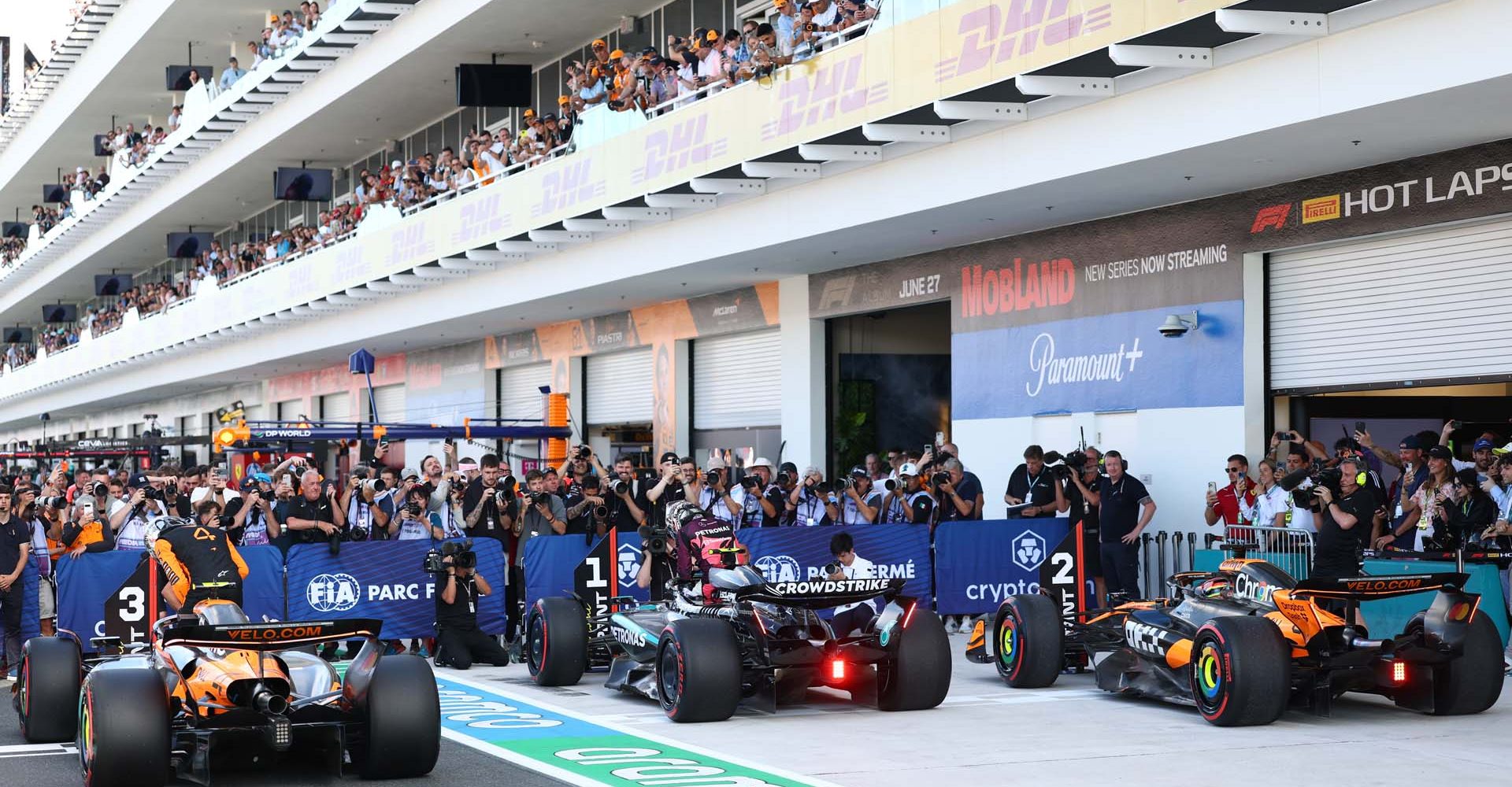 MIAMI, FLORIDA - MAY 02: Sprint Pole qualifier Andrea Kimi Antonelli of Italy and Mercedes AMG Petronas F1 Team Sprint 2nd qualifier Oscar Piastri of Australia and McLaren and Sprint 3rd qualifier Lando Norris of Great Britain and McLaren in parc ferme during Sprint qualifying ahead of the F1 Grand Prix of Miami at Miami International Autodrome on May 02, 2025 in Miami, Florida. (Photo by Zak Mauger/LAT Images)