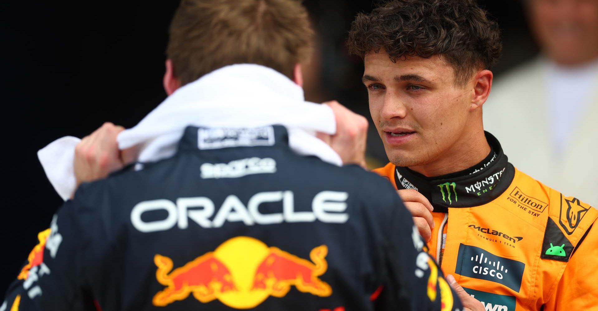 MIAMI, FLORIDA - MAY 03: Pole position qualifier Max Verstappen of the Netherlands and Oracle Red Bull Racing and Second placed qualifier Lando Norris of Great Britain and McLaren talk in parc ferme during qualifying ahead of the F1 Grand Prix of Miami at Miami International Autodrome on May 03, 2025 in Miami, Florida. (Photo by Zak Mauger/LAT Images)