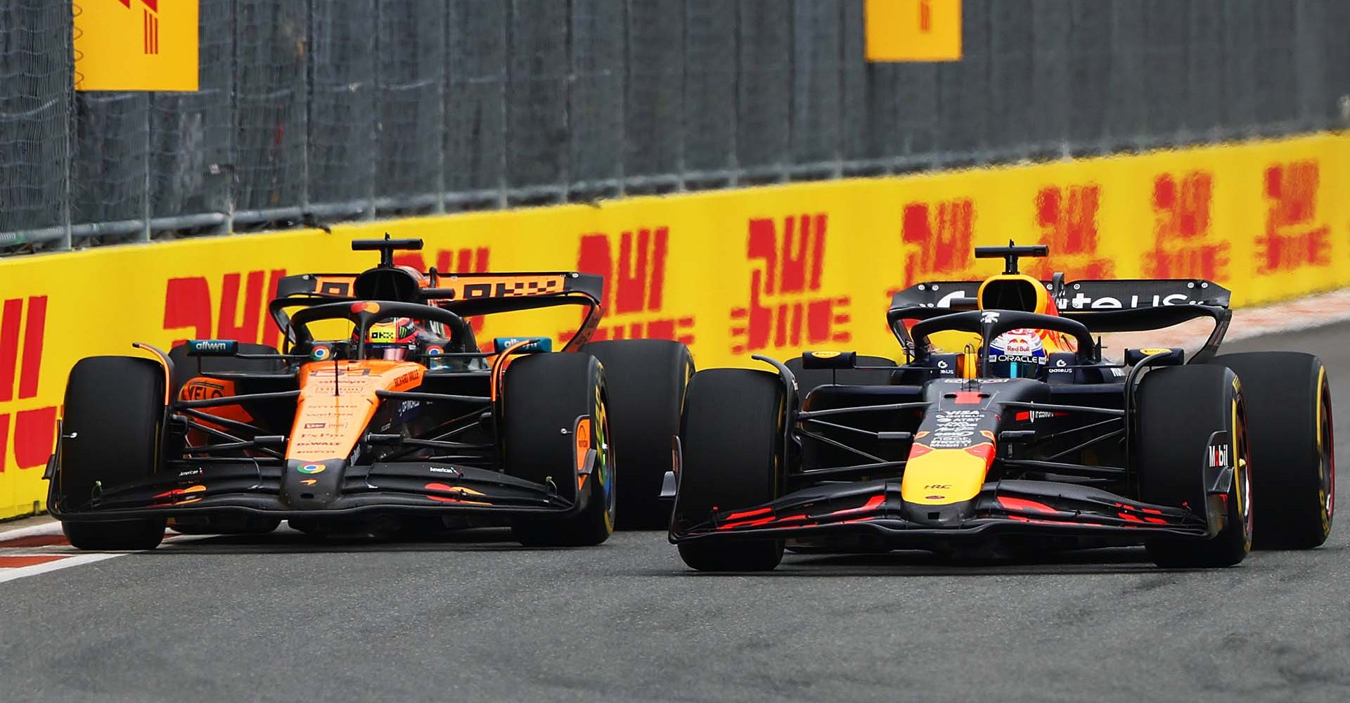 MIAMI, FLORIDA - MAY 04: Max Verstappen of the Netherlands driving the (1) Oracle Red Bull Racing RB21 and Oscar Piastri of Australia driving the (81) McLaren MCL39 Mercedes battle for track position on track during the F1 Grand Prix of Miami at Miami International Autodrome on May 04, 2025 in Miami, Florida. (Photo by Andy Hone/LAT Images)
