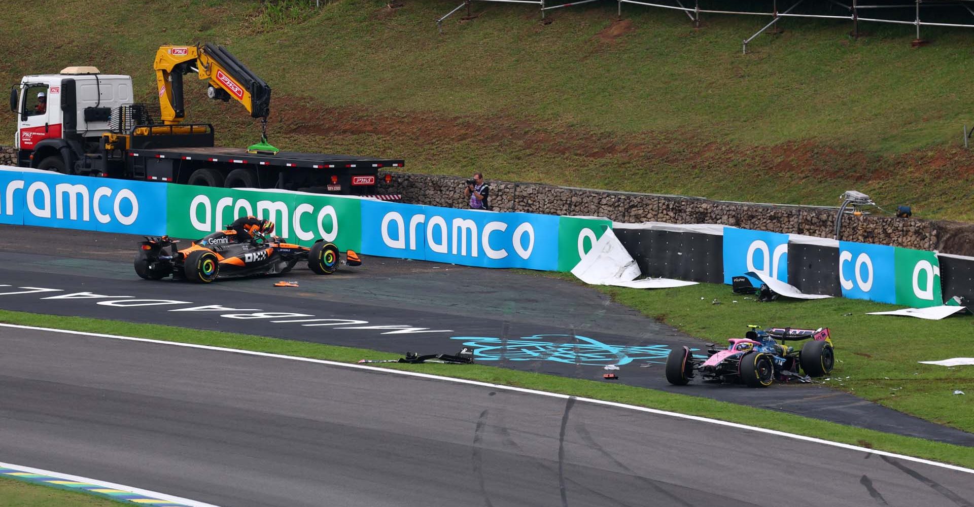 SAO PAULO, BRAZIL - NOVEMBER 08: Oscar Piastri of Australia driving the (81) McLaren MCL39 Mercedes and Franco Colapinto of Argentina driving the (43) Alpine F1 A525 Renault crash out of the race during the Sprint ahead of the F1 Grand Prix of Brazil at Autodromo Jose Carlos Pace on November 08, 2025 in Sao Paulo, Brazil. (Photo by Mark Thompson/Getty Images)