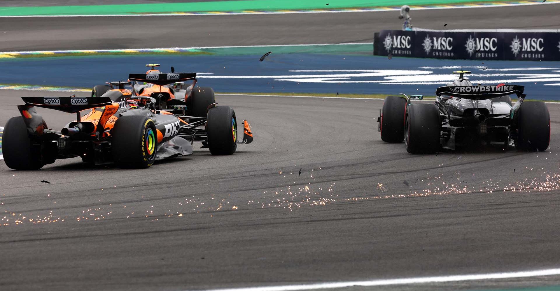 SAO PAULO, BRAZIL - NOVEMBER 09: Lando Norris of Great Britain driving the (4) McLaren MCL39 Mercedes, Andrea Kimi Antonelli of Italy driving the (12) Mercedes AMG Petronas F1 Team W16 and Oscar Piastri of Australia driving the (81) McLaren MCL39 Mercedes battle for track position during the F1 Grand Prix of Brazil at Autodromo Jose Carlos Pace on November 09, 2025 in Sao Paulo, Brazil. (Photo by Mark Thompson/Getty Images)