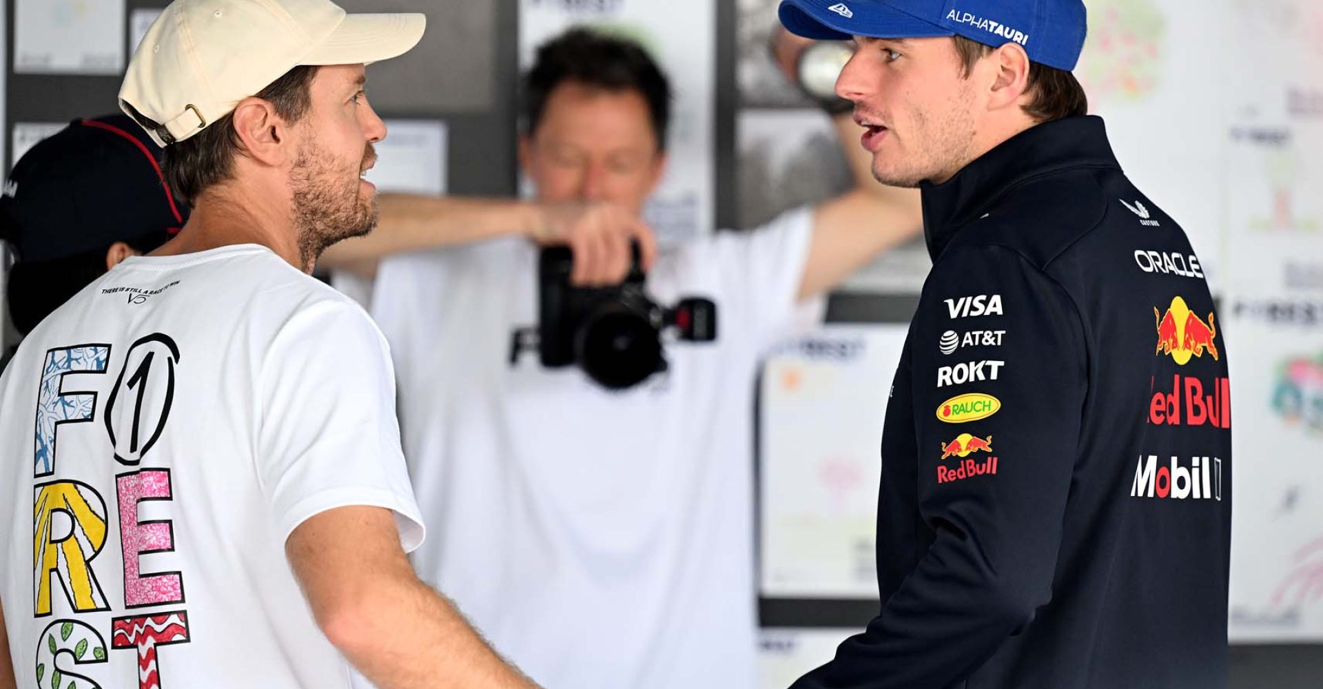 SAO PAULO, BRAZIL - NOVEMBER 09: Sebastian Vettel with Max Verstappen of the Netherlands and Oracle Red Bull Racing in the Forest F1 garage prior to the F1 Grand Prix of Brazil at Autodromo Jose Carlos Pace on November 09, 2025 in Sao Paulo, Brazil. (Photo by Simon Galloway/LAT Images) // Getty Images / Red Bull Content Pool // SI202511090402 // Usage for editorial use only //