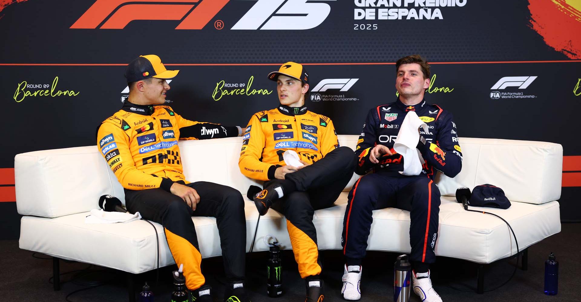 BARCELONA, SPAIN - MAY 31: Pole position qualifier Oscar Piastri of Australia and McLaren Second placed qualifier Lando Norris of Great Britain and McLaren and Third placed qualifier Max Verstappen of the Netherlands and Oracle Red Bull Racing in the Drivers Press Conference during qualifying ahead of the F1 Grand Prix of Spain at Circuit de Barcelona-Catalunya on May 31, 2025 in Barcelona, Spain. (Photo by Clive Rose/Getty Images)