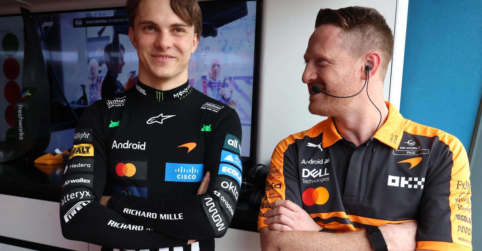 MELBOURNE, AUSTRALIA - MARCH 07: Oscar Piastri of Australia and McLaren talks with a teammate in the garage during final practice ahead of the F1 Grand Prix of Australia at Albert Park Grand Prix Circuit on March 07, 2026 in Melbourne, Australia. (Photo by Steven Tee/LAT Images)