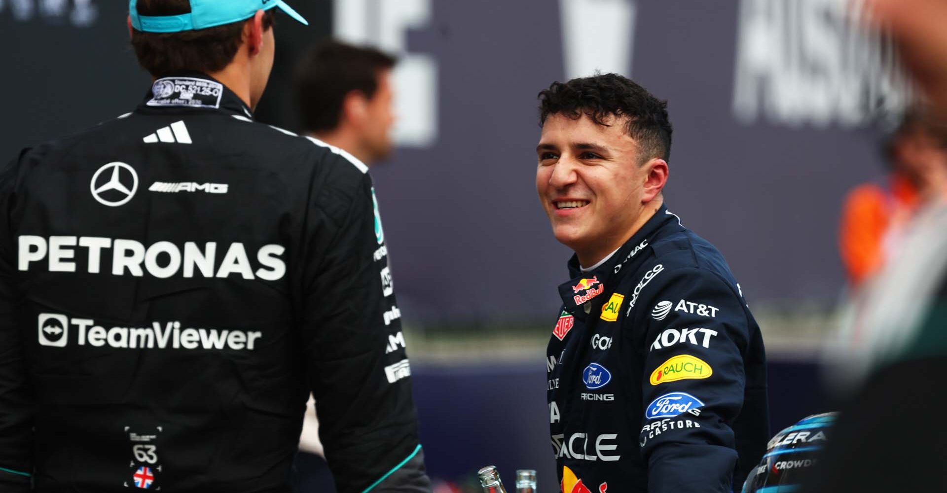 MELBOURNE, AUSTRALIA - MARCH 07: Pole position qualifier George Russell of Great Britain and Mercedes AMG Petronas F1 Team and Third placed qualifier Isack Hadjar of France and Oracle Red Bull Racing talk in parc ferme during qualifying ahead of the F1 Grand Prix of Australia at Albert Park Grand Prix Circuit on March 07, 2026 in Melbourne, Australia. (Photo by Mark Thompson/Getty Images) // Getty Images / Red Bull Content Pool // SI202603070327 // Usage for editorial use only //