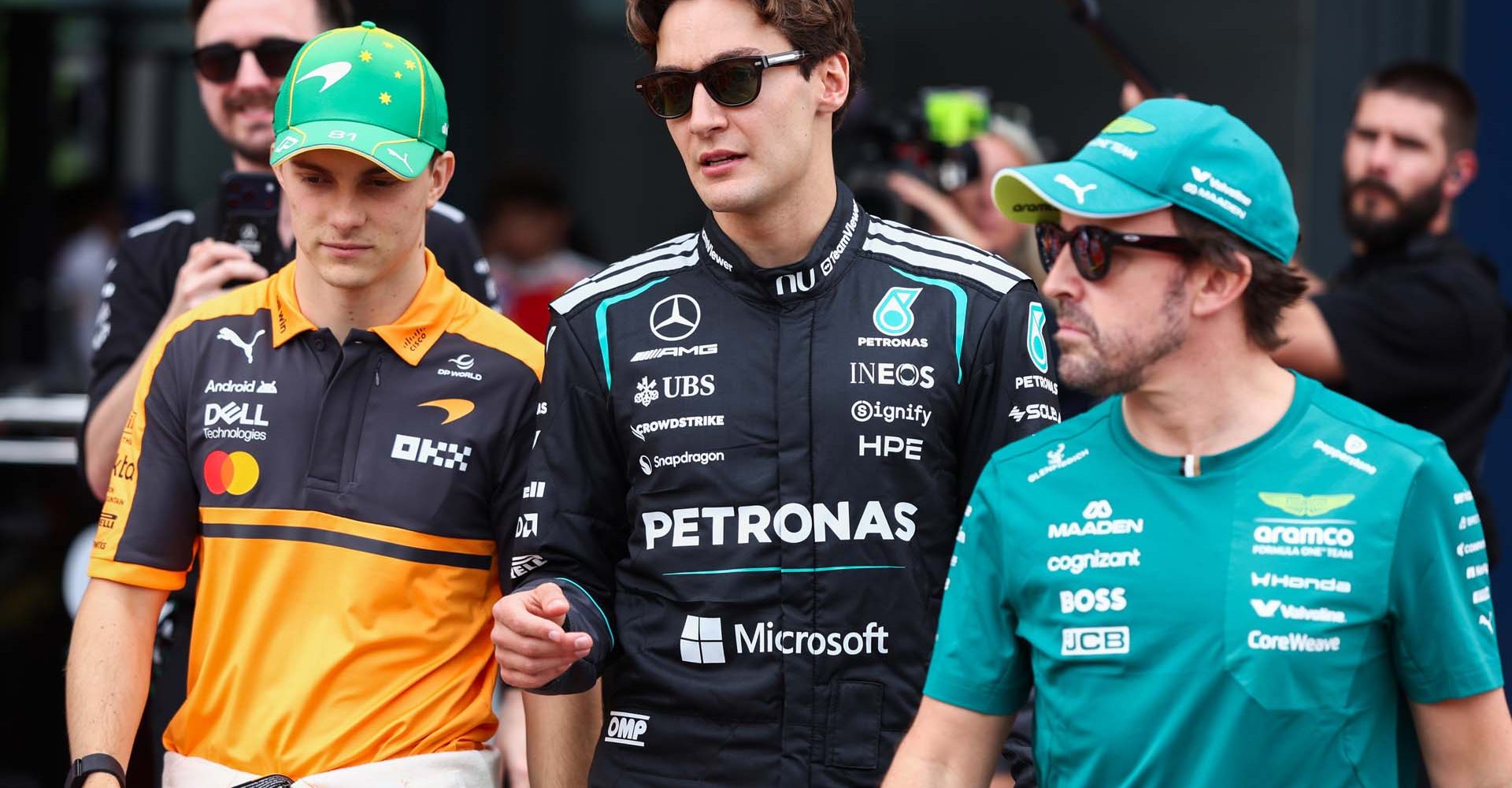 MELBOURNE, AUSTRALIA - MARCH 08: Oscar Piastri of Australia and McLaren George Russell of Great Britain and Mercedes AMG Petronas F1 Team and Fernando Alonso of Spain and Aston Martin F1 Team on the drivers parade prior to the F1 Grand Prix of Australia at Albert Park Grand Prix Circuit on March 08, 2026 in Melbourne, Australia. (Photo by Peter Fox/Getty Images)