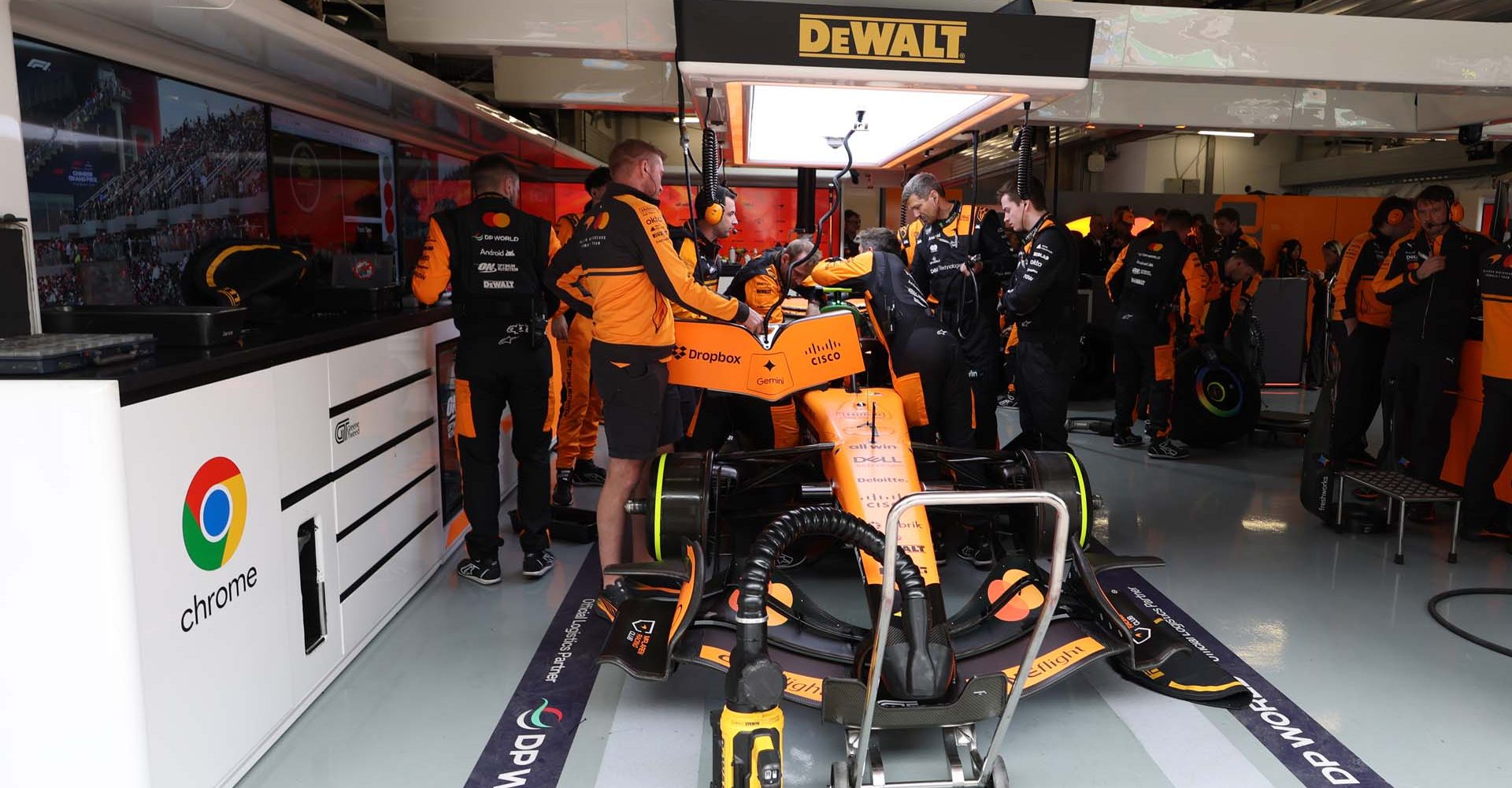 SHANGHAI, CHINA - MARCH 15: Mechanics work on the car of Lando Norris of Great Britain driving the (1) McLaren MCL40 Mercedes in the garage prior to the F1 Grand Prix of China at Shanghai International Circuit on March 15, 2026 in Shanghai, China. (Photo by Steven Tee/LAT Images)