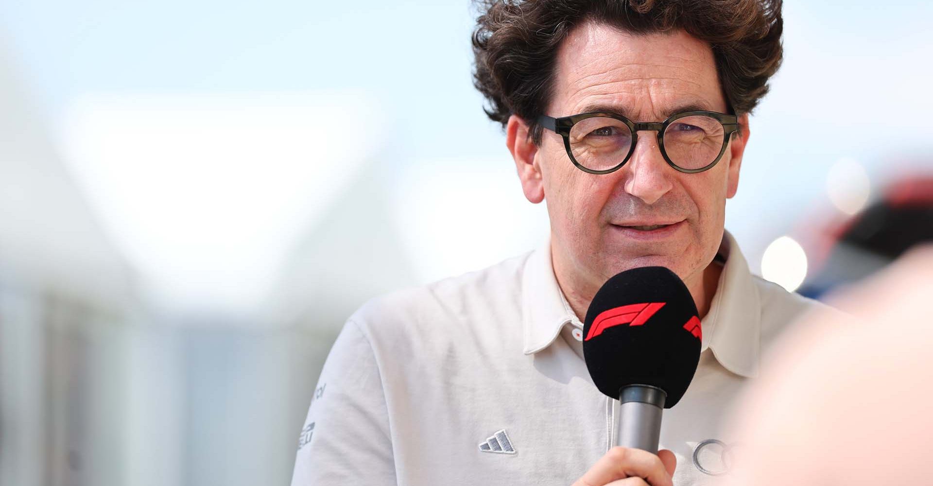 SUZUKA, JAPAN - MARCH 27: Mattia Binotto, COO and CTO of Audi F1 Team is interviewed during practice ahead of the F1 Grand Prix of Japan at Suzuka Circuit on March 27, 2026 in Suzuka, Japan. (Photo by Andy Hone/LAT Images)
