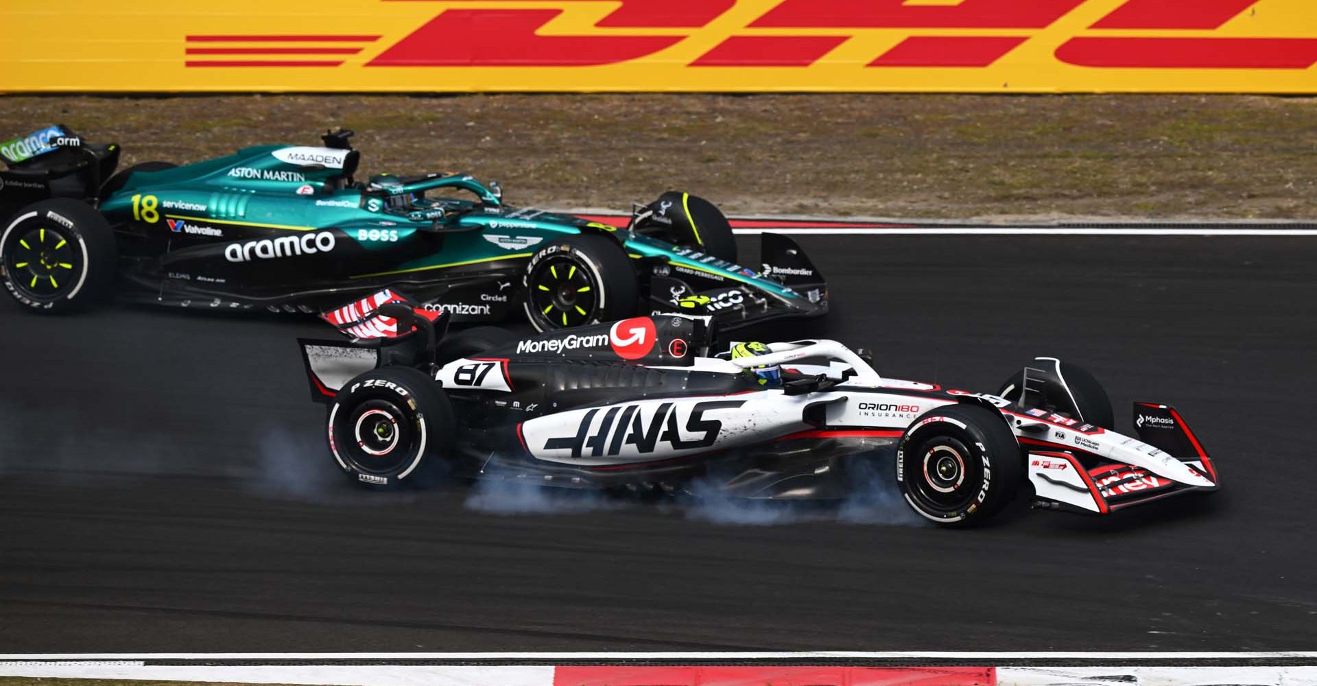 SHANGHAI, CHINA - MARCH 23: Oliver Bearman of Great Britain driving the (87) Haas F1 VF-25 Ferrari leads Lance Stroll of Canada driving the (18) Aston Martin F1 Team AMR25 Mercedes on track during the F1 Grand Prix of China at Shanghai International Circuit on March 23, 2025 in Shanghai, China. (Photo by Clive Mason/Getty Images)